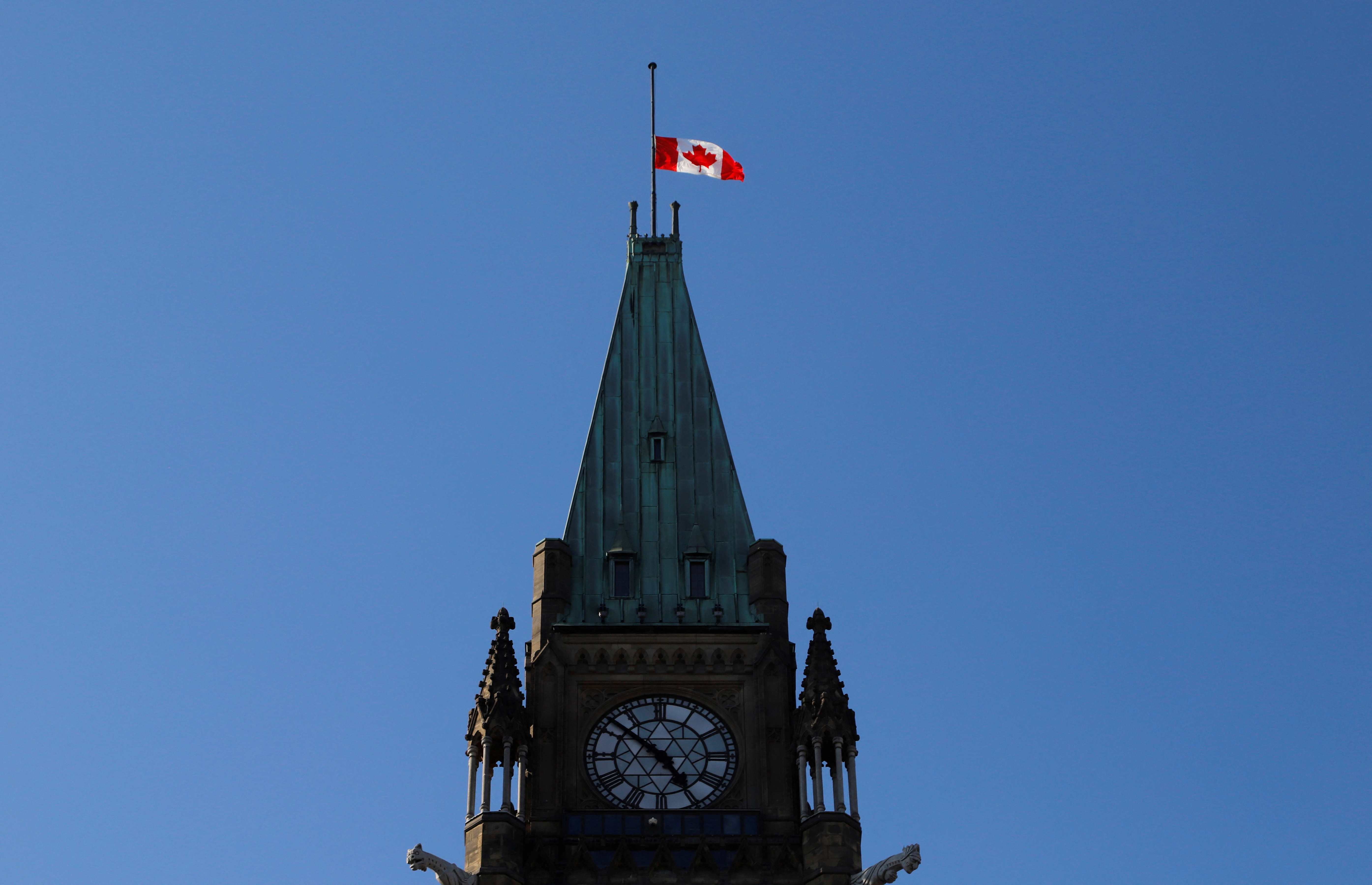 The Canadian flag flies at half staff on the Peace Tower at the Parliament Buildings, after Queen Elizabeth's passing, in Ottawa