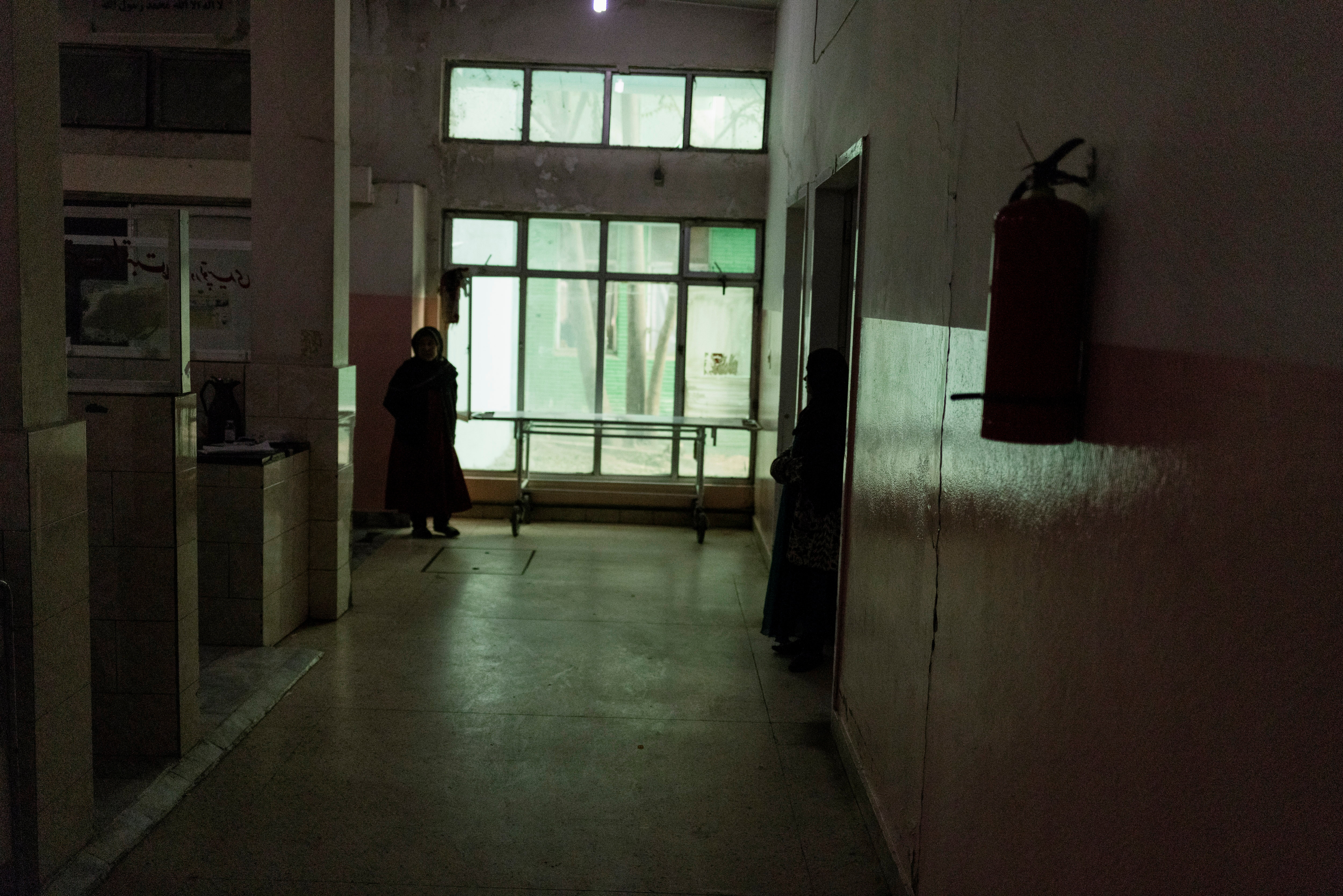 Women stand at the intensive care ward of the children hospital in Kabul