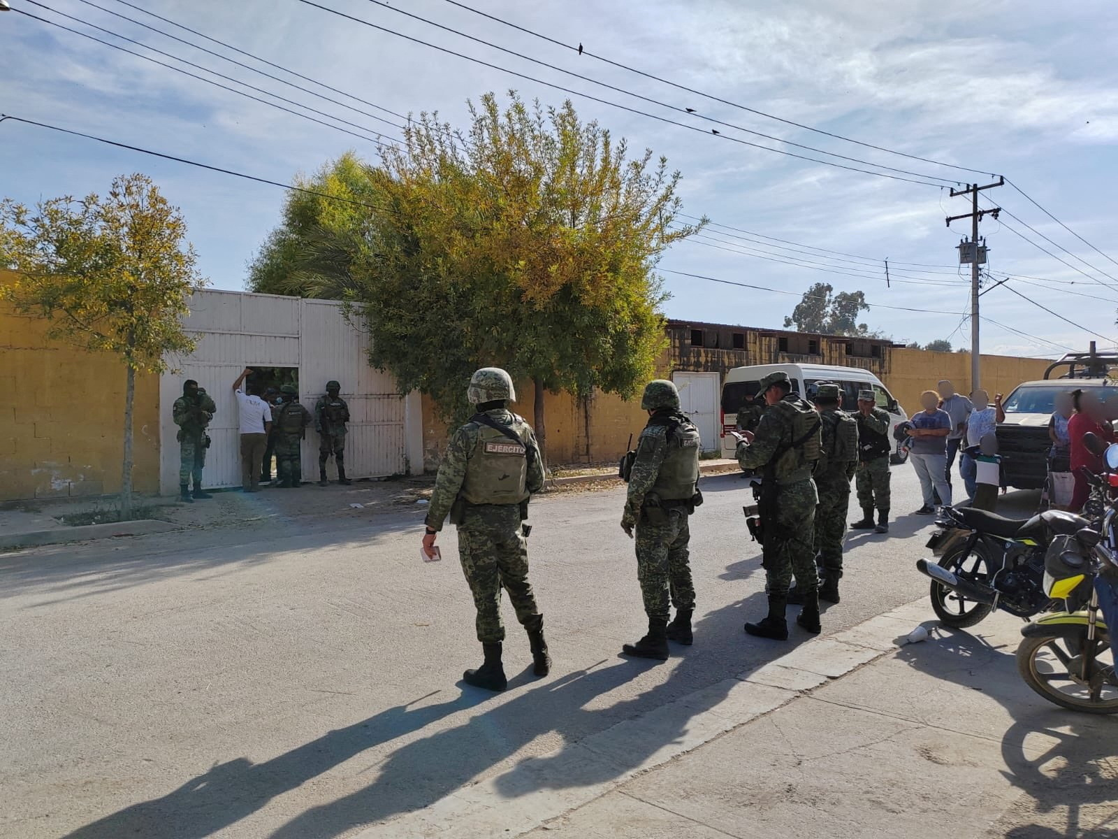 Members of the security forces work on a rescue operation of kidnapped migrants, in Ciudad Lerdo