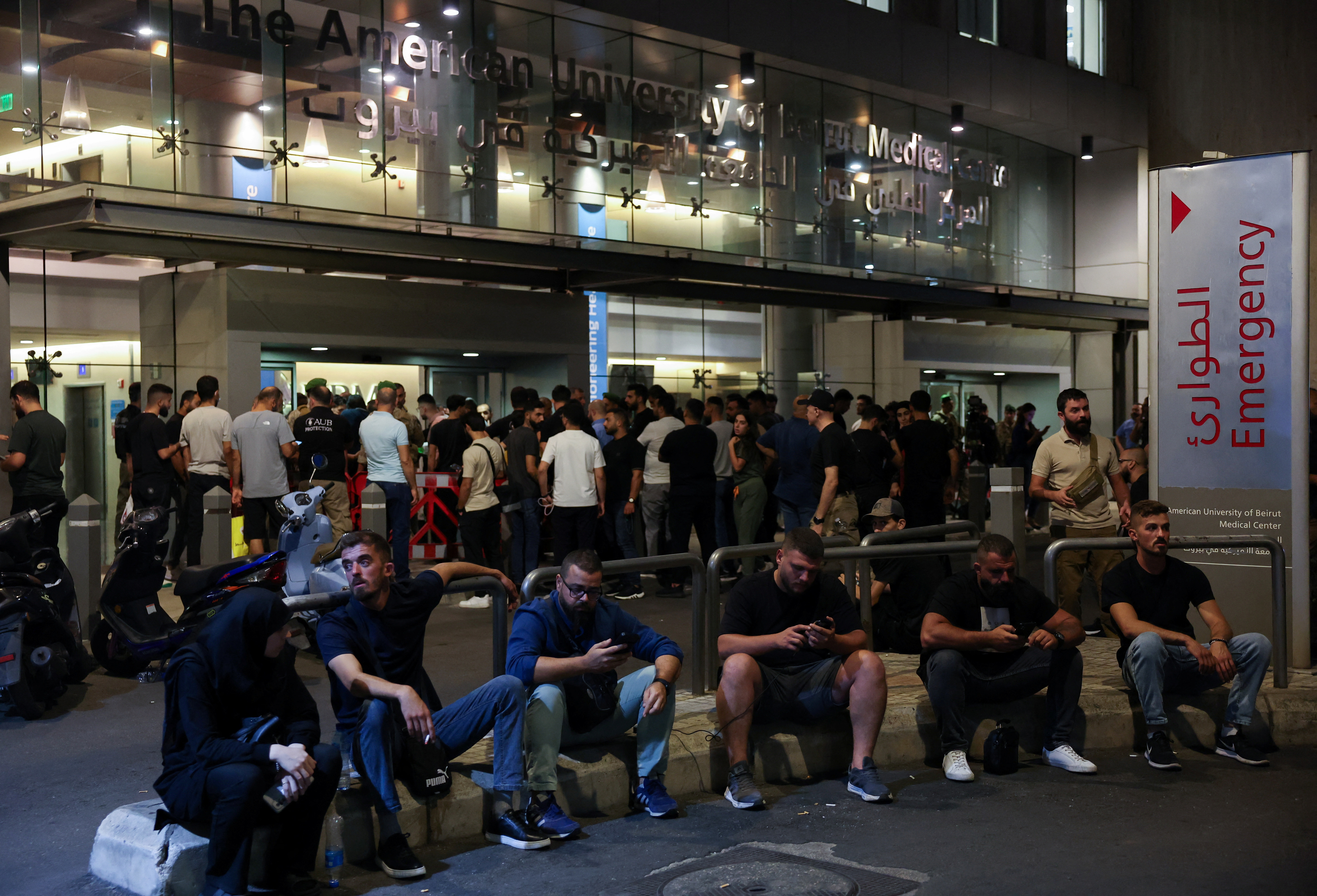 People gather outside American University of Beirut Medical Center in Beirut