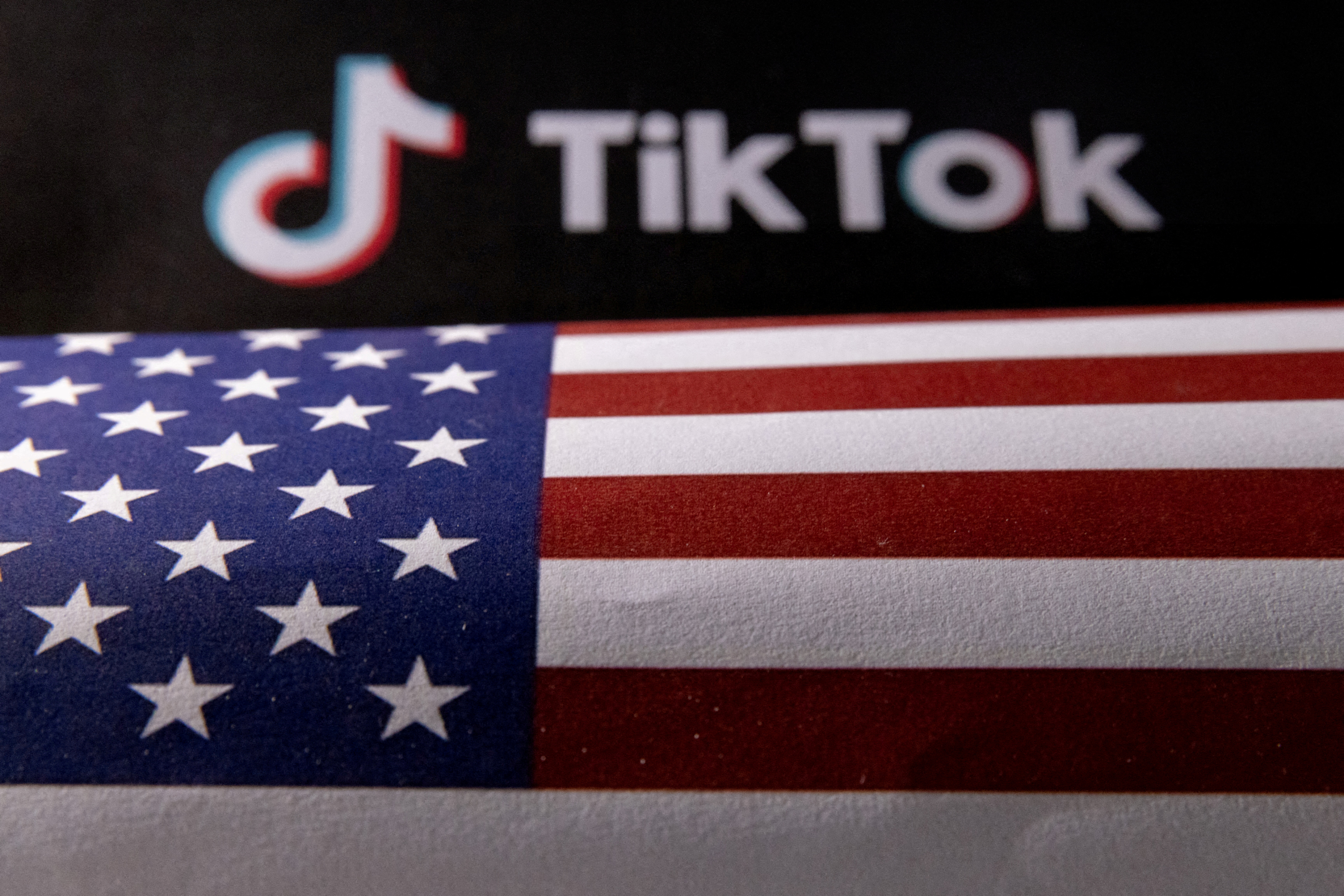 Illustration shows U.S. flag and TikTok logo