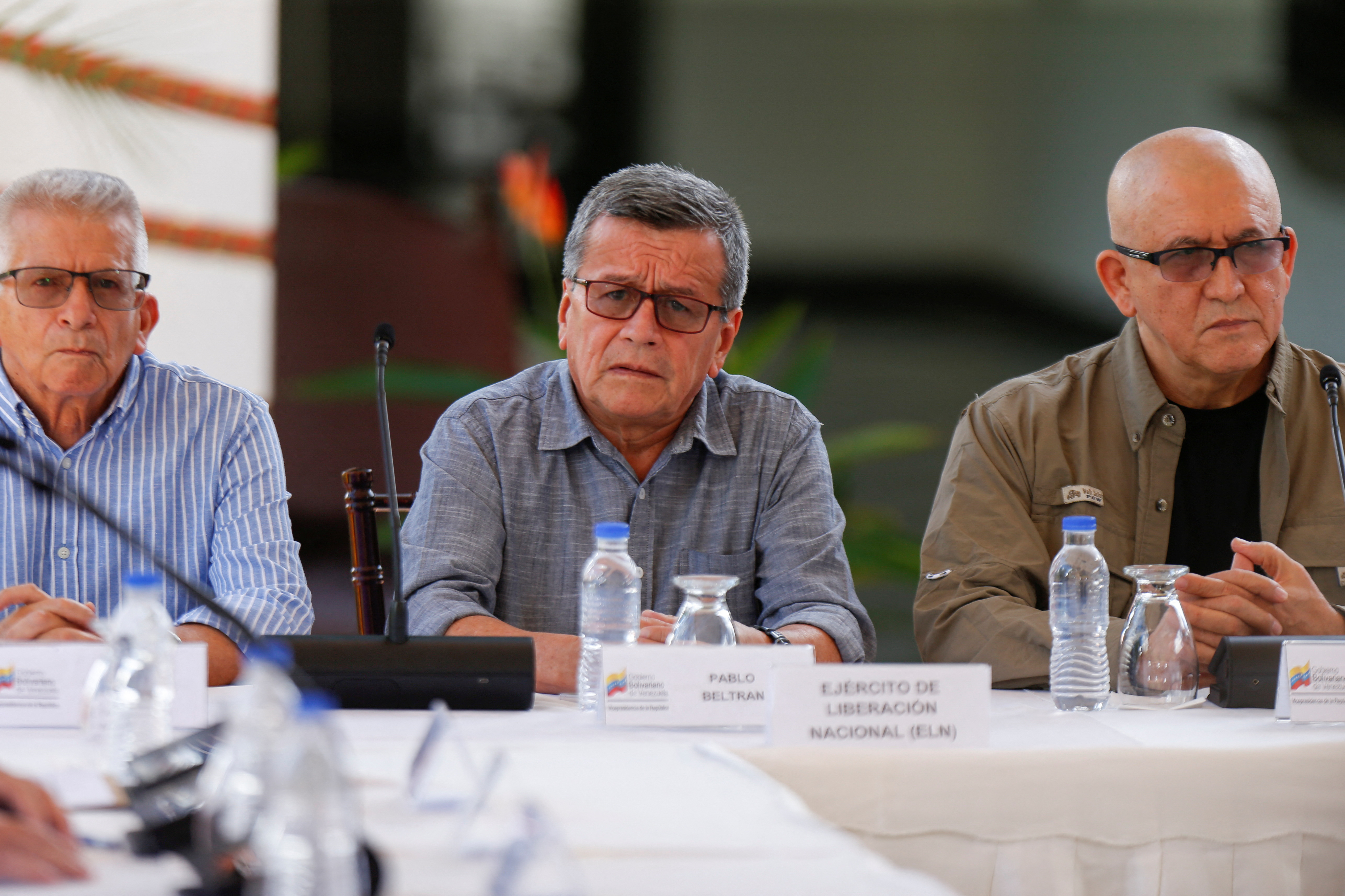 Members of Colombia's government and Colombia's National Liberation Army (ELN) delegation address the media, in Caracas