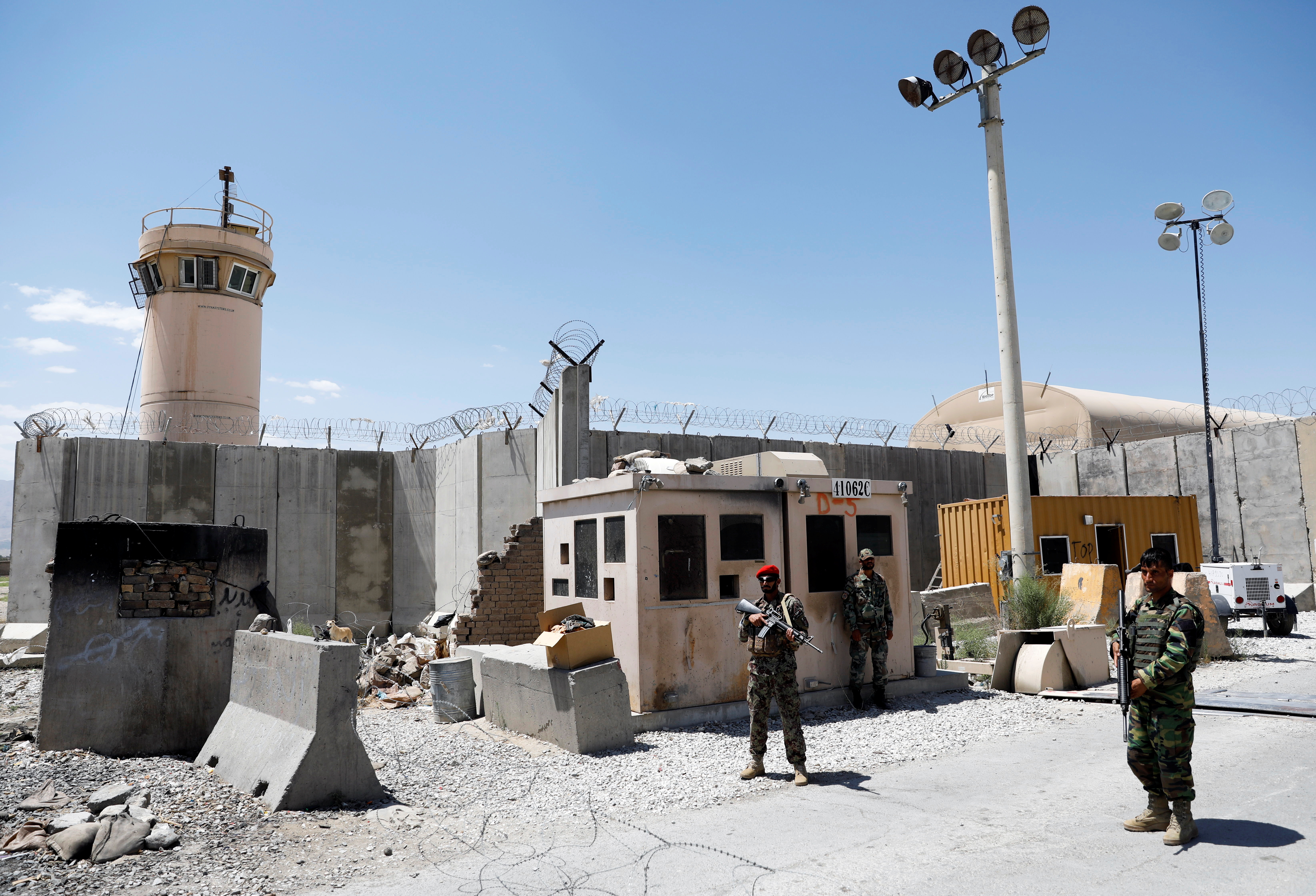 Afghan soldiers stand guard at gate of Bagram U.S. air base gate