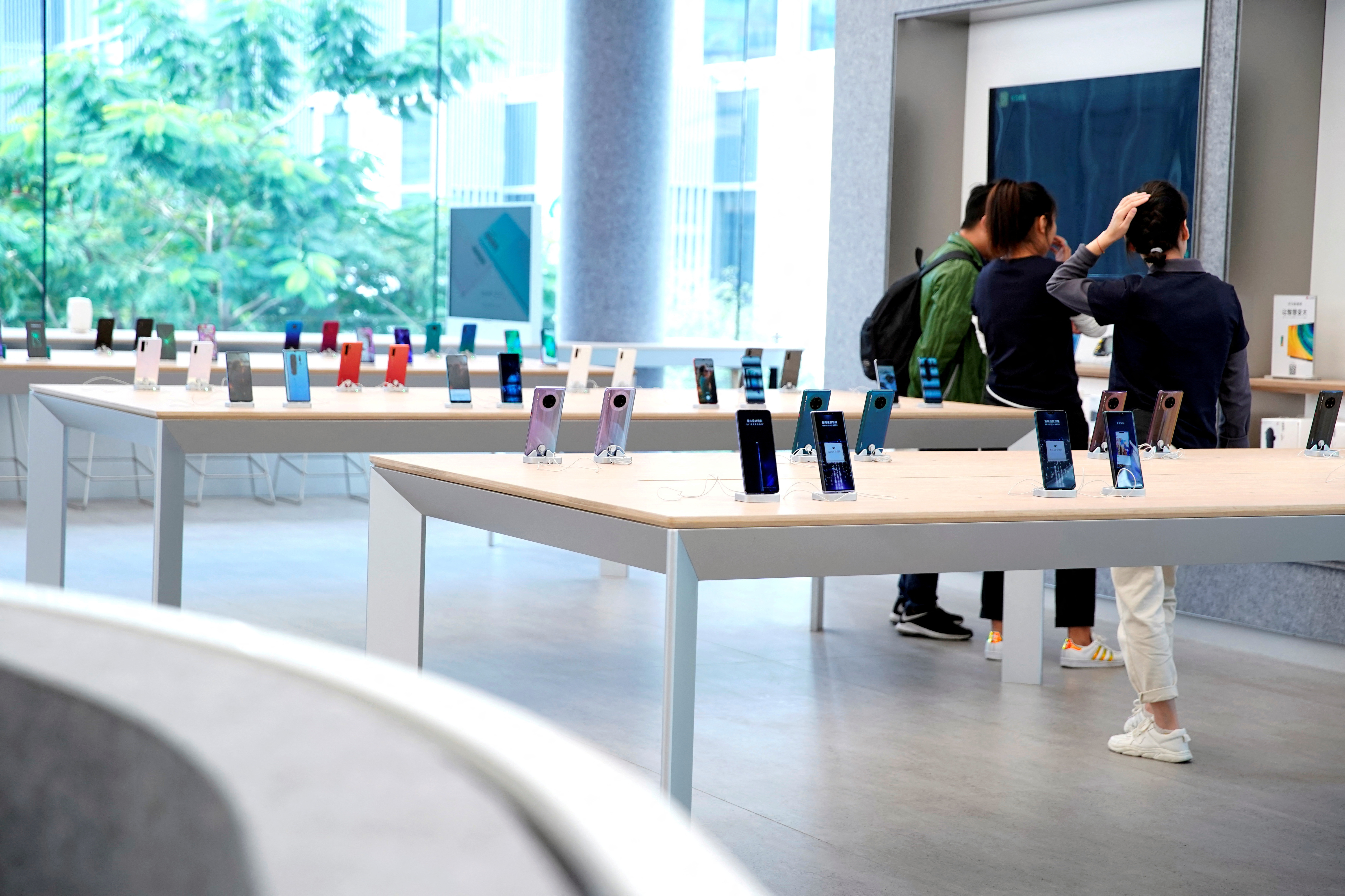 Smartphones are displayed in Huawei's first global flagship store in Shenzhen