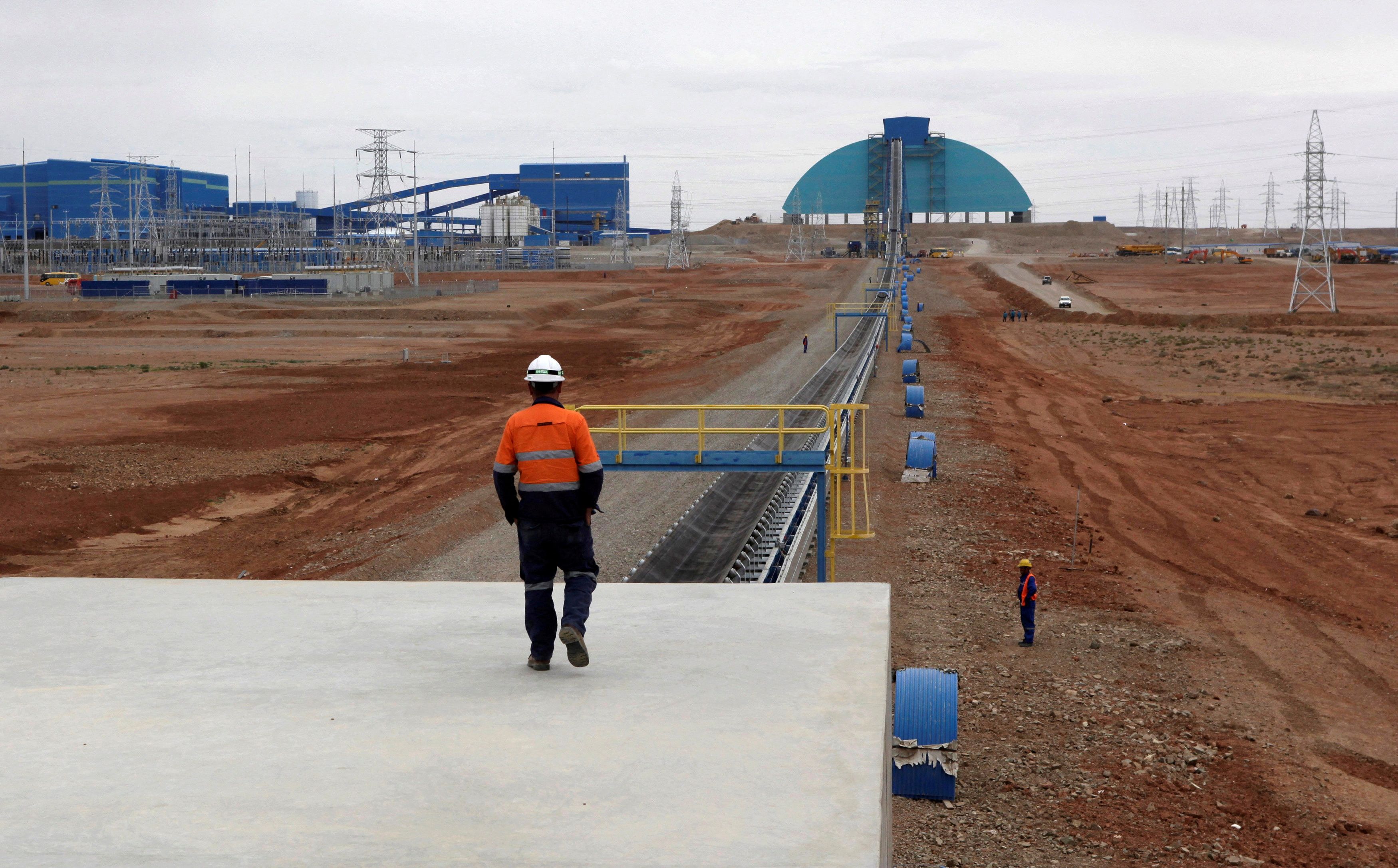 An employee looks at the Oyu Tolgoi mine in Mongolia's South Gobi region