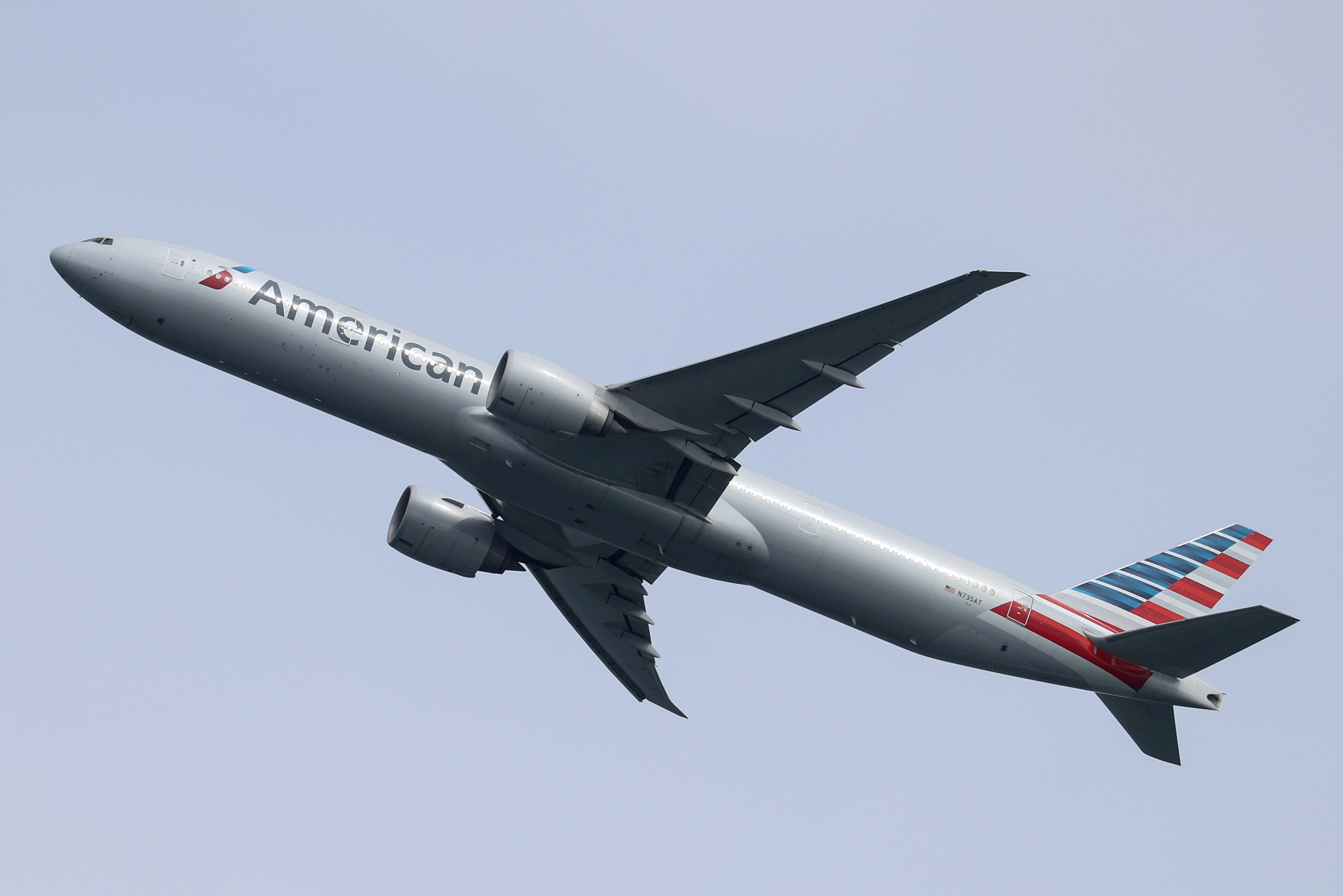 An American Airlines Boeing 777-300ER plane takes off from Sydney Airport in Sydney, Australia, October 28, 2020.  REUTERS/Loren Elliott 