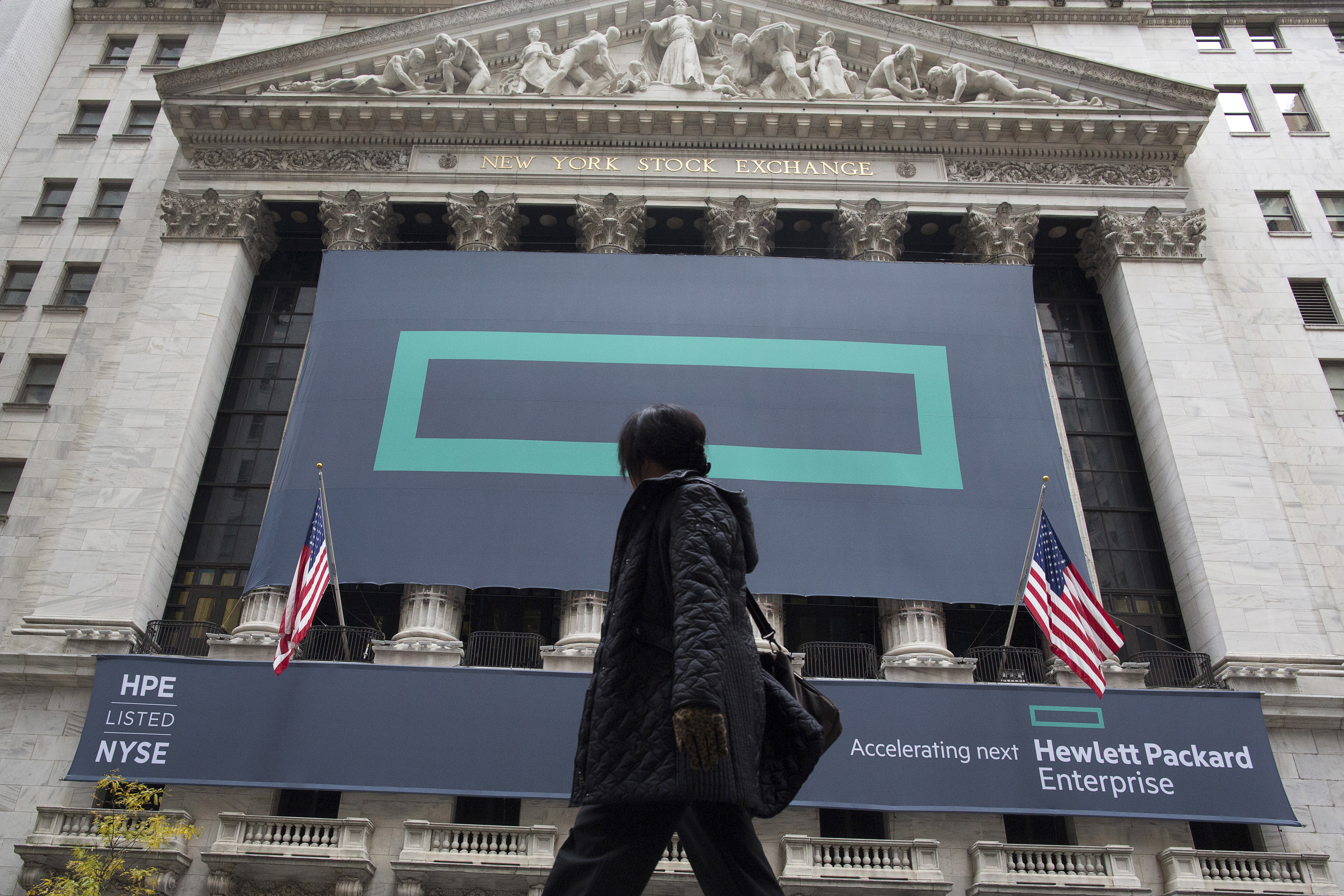 Signs for Hewlett Packard Enterprise Co., cover the facade of the New York Stock Exchange