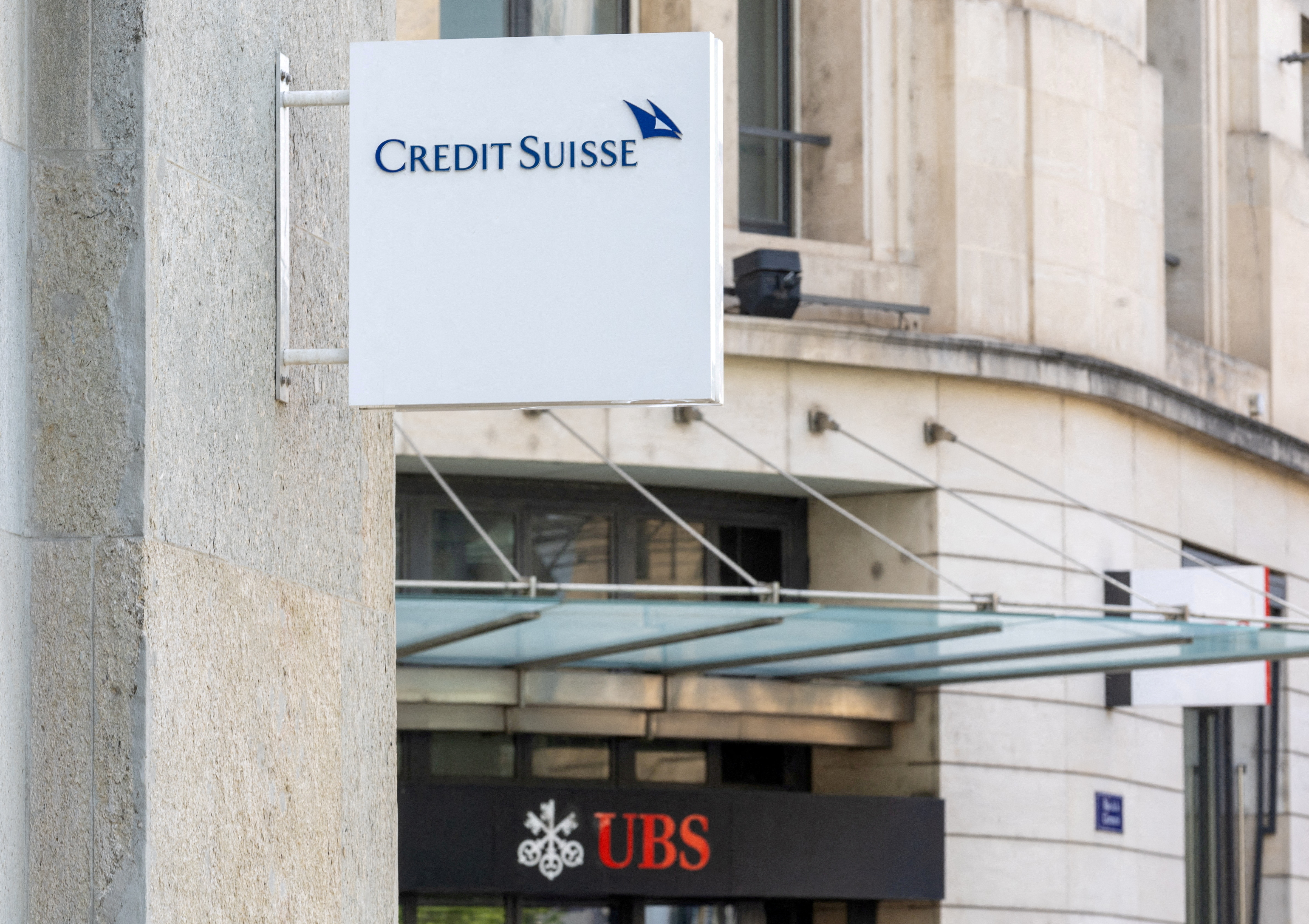 The logos of Swiss bank Credit Suisse and UBS are seen in Geneva, Switzerland