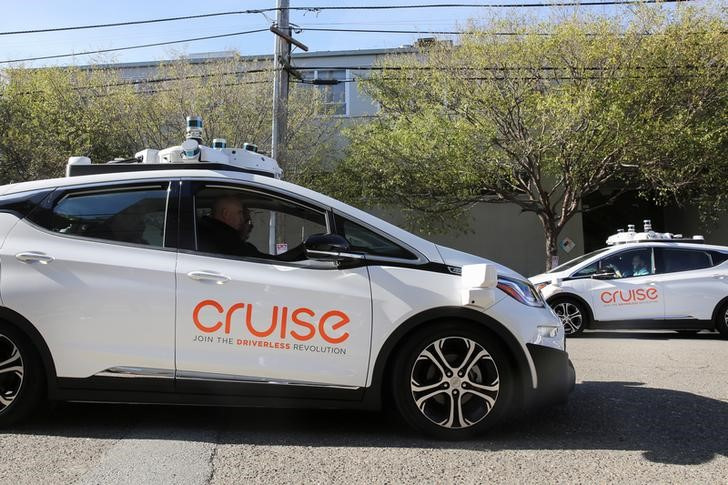 Two self-driving Chevy Bolt EV cars are seen during a media event by Cruise, GM’s autonomous car unit,  in San Francisco