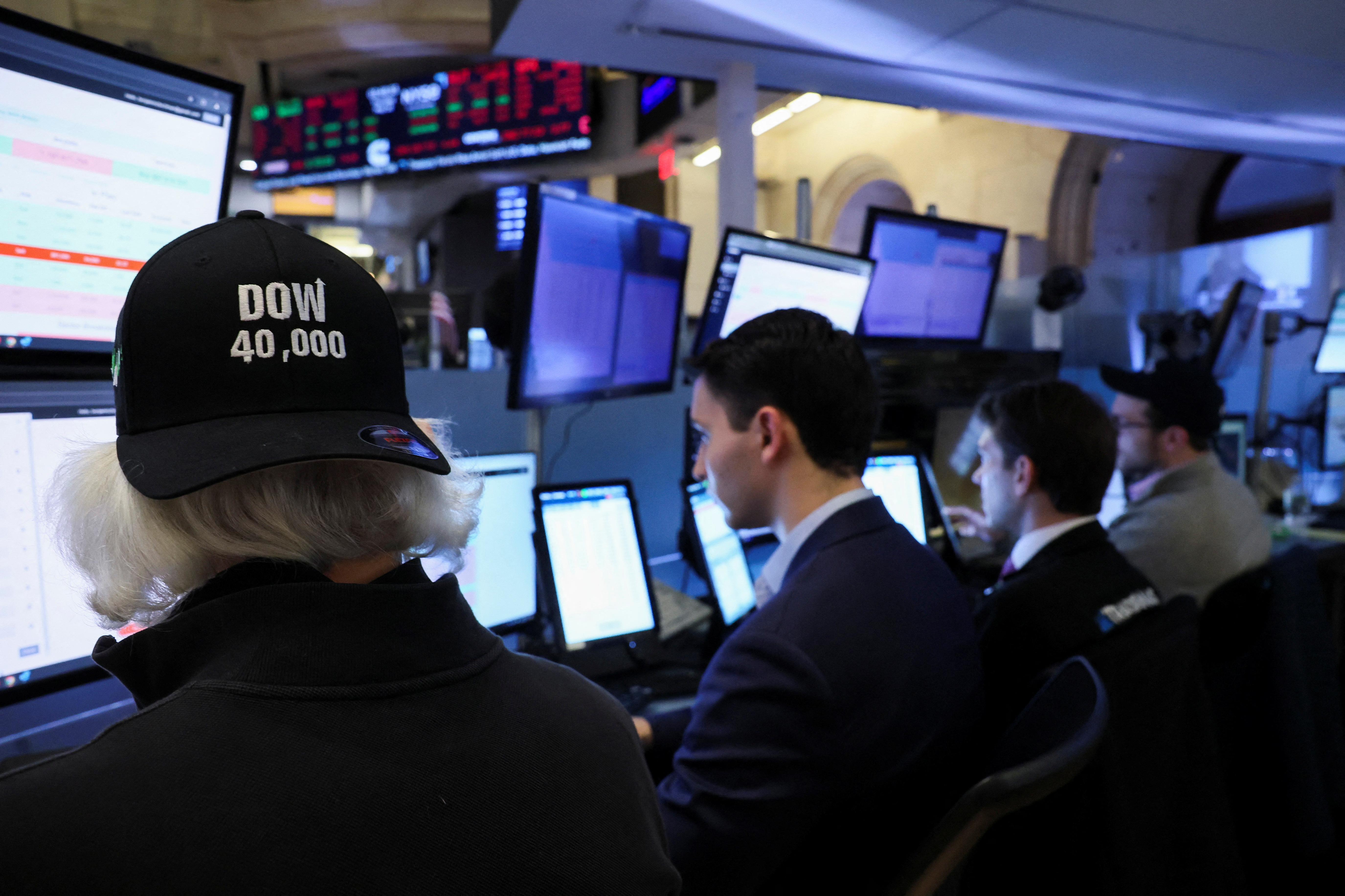 Traders work on the floor at the New York Stock Exchange (NYSE) in New York City