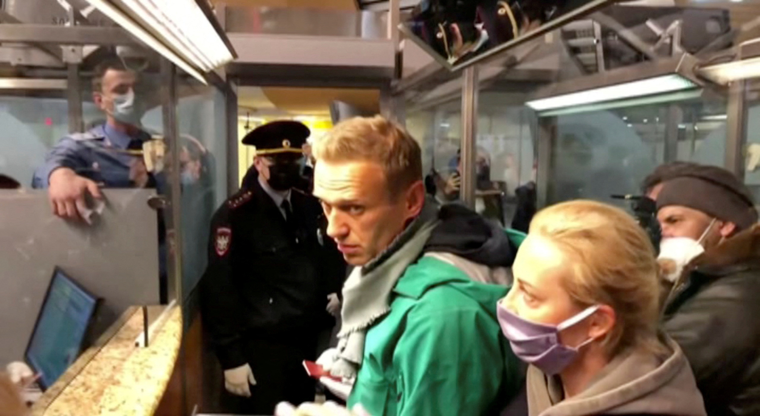 Police officers detain Russian opposition leader Alexei Navalny in Moscow
