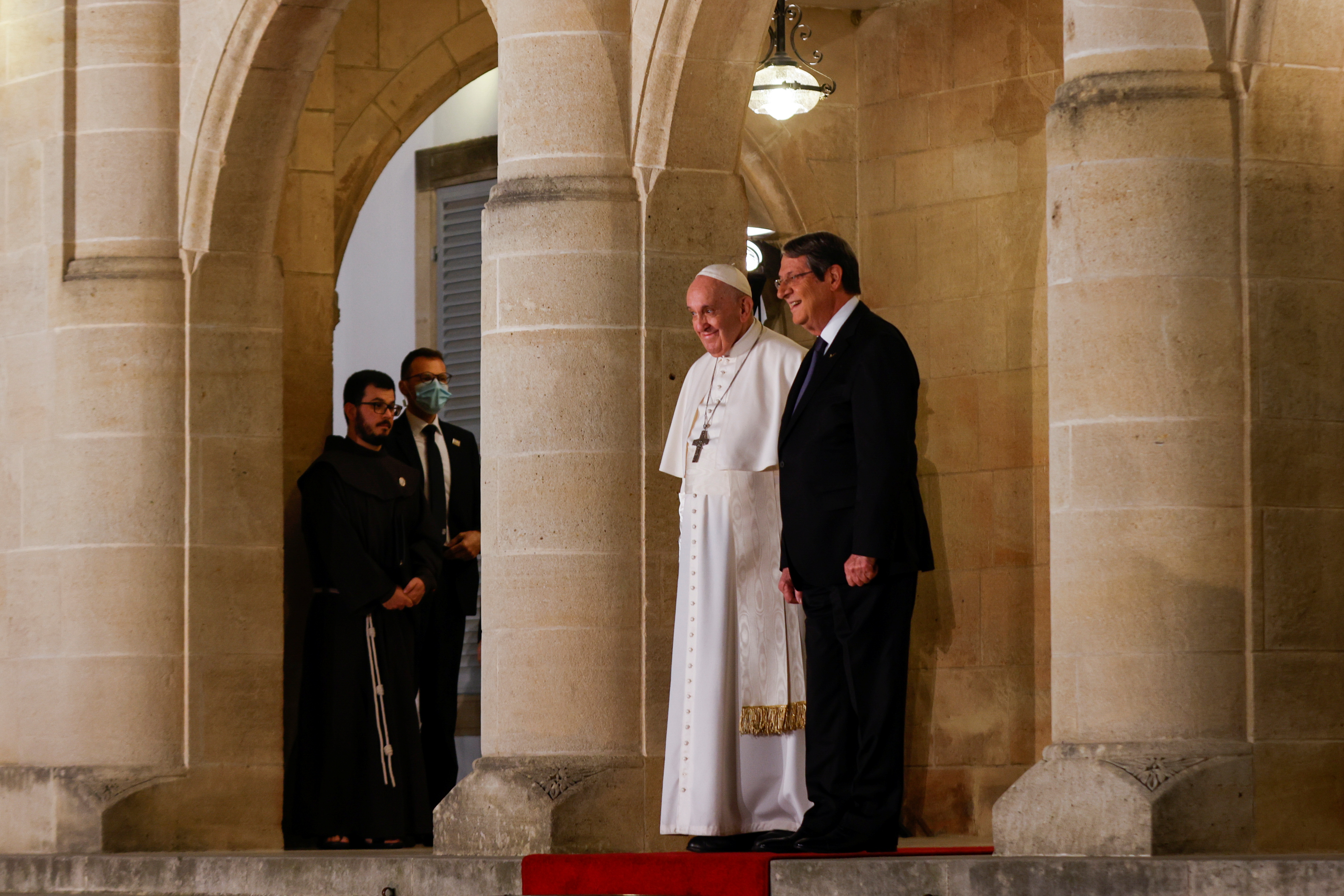 Cypriot President Nicos Anastasiades and Pope Francis stand at the Presidential Palace, in Nicosia, Cyprus, December 2, 2021. REUTERS/Amir Cohen