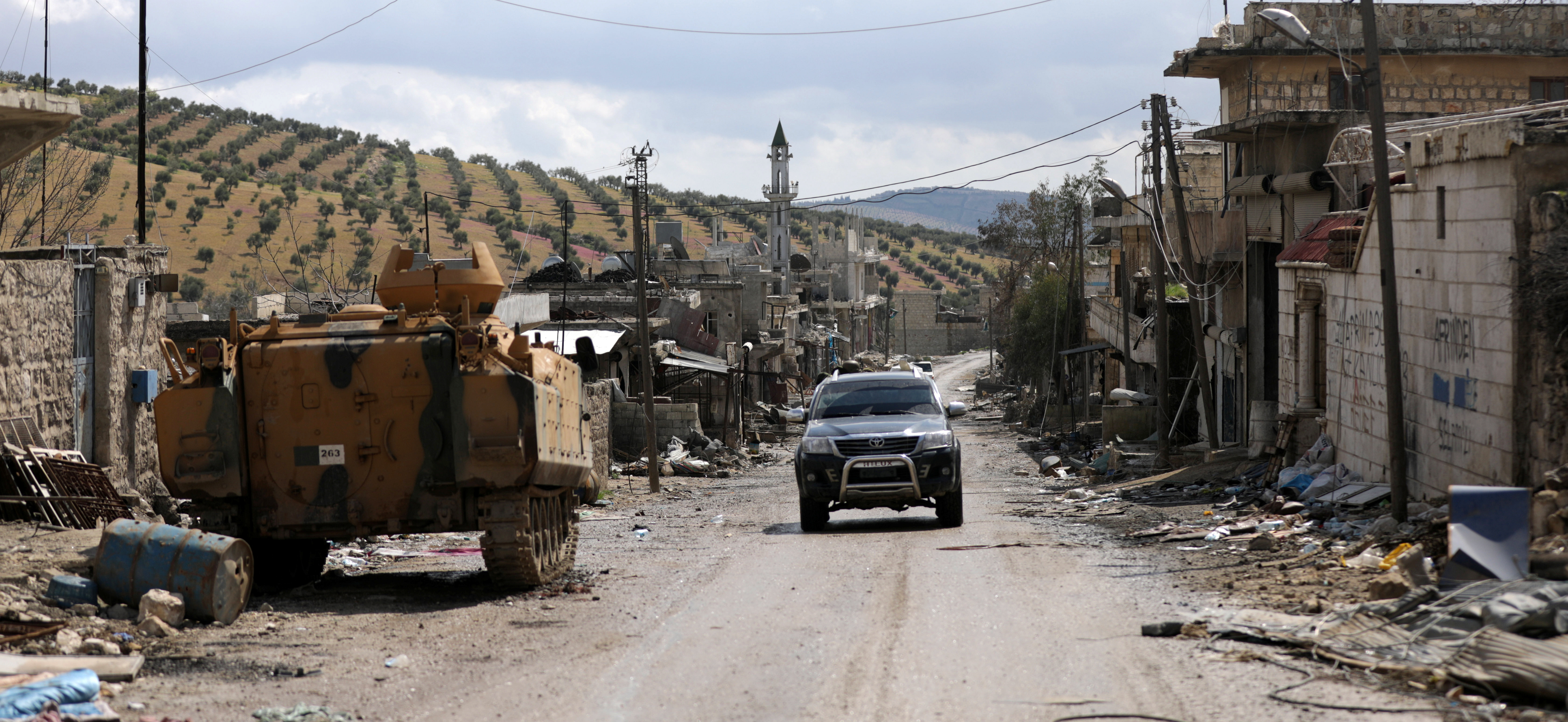 A miltary vehicle is seen in the north east of Afrin