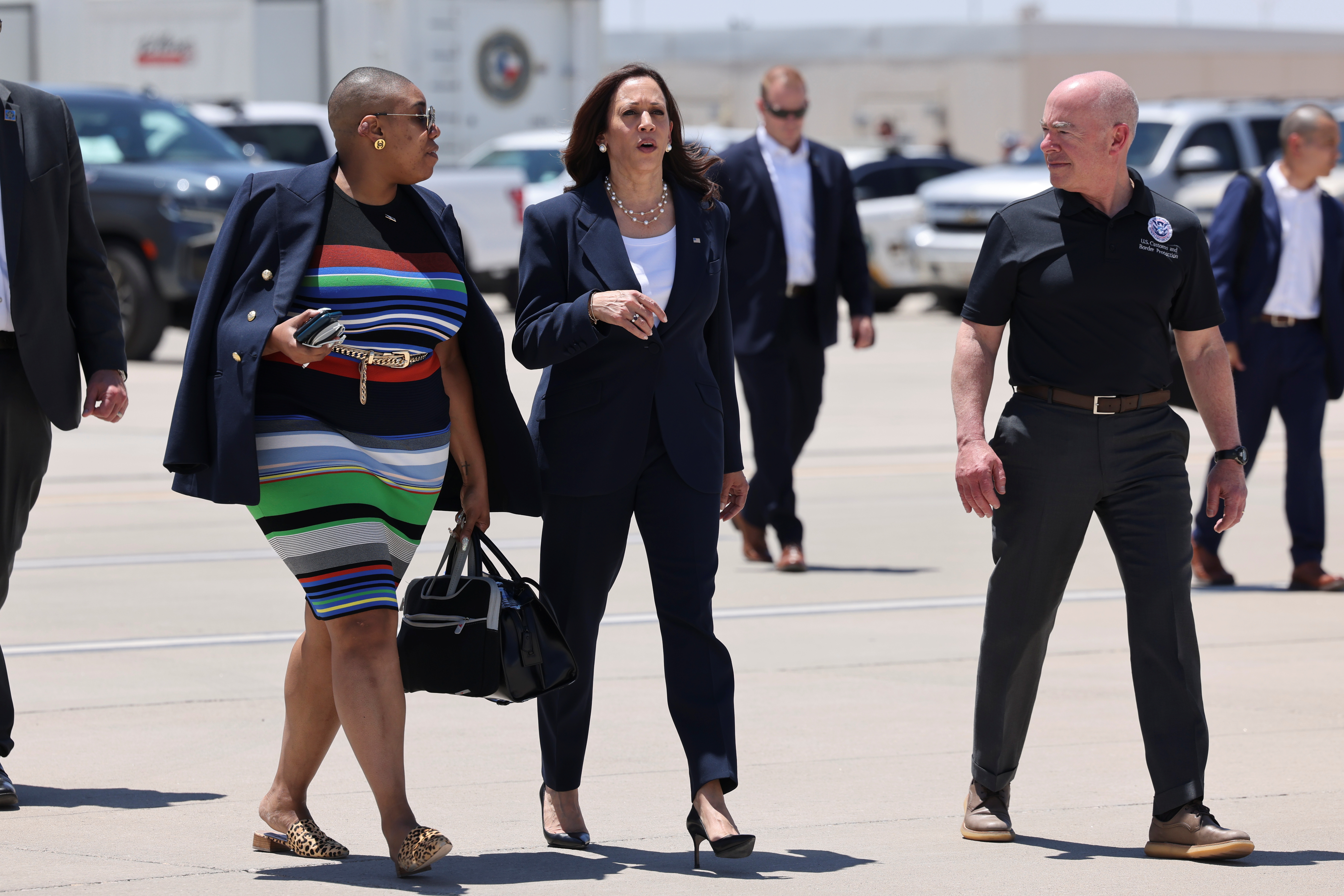 U.S. Vice President Kamala Harris walks with Department of Homeland Security (DHS) Secretary Alejandro Mayorkas and Spokesperson Symone Sanders to board Air Force Two at El Paso International Airport in El Paso, Texas, U.S., June 25, 2021. REUTERS/Evelyn Hockstein