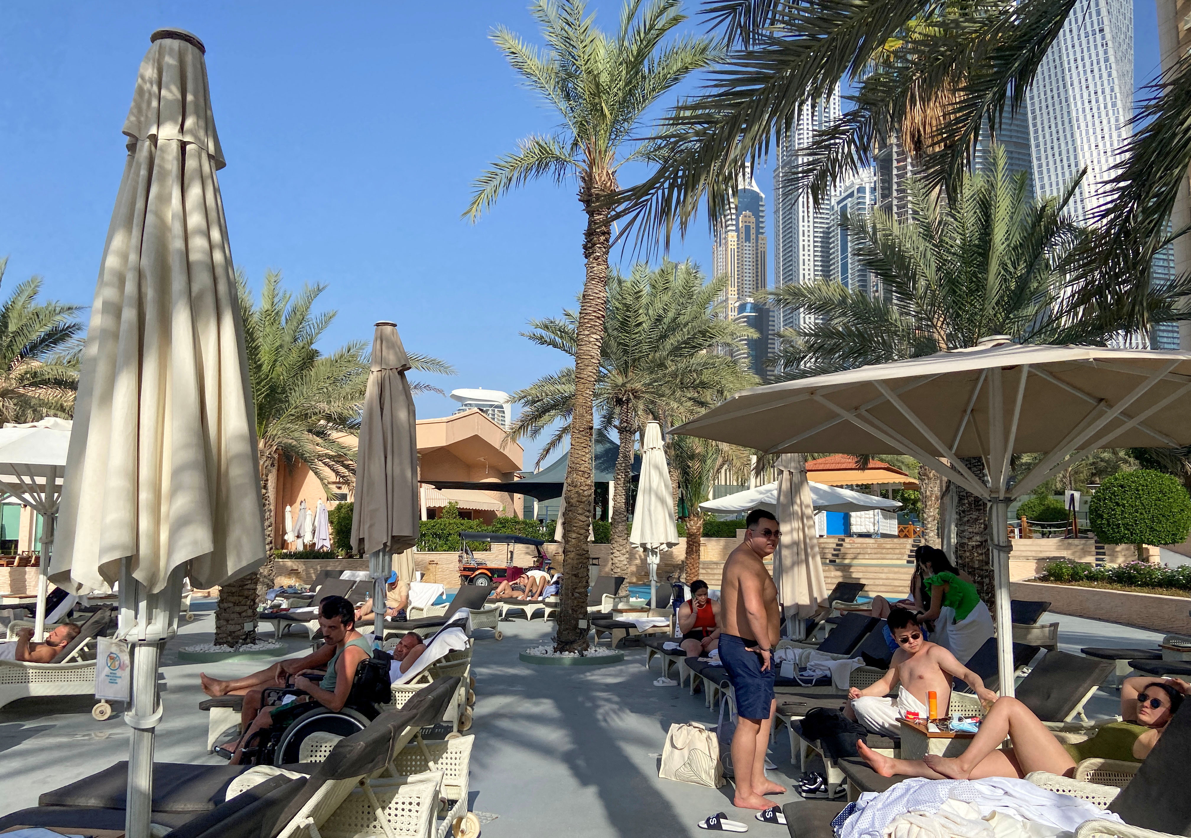 Tourists rest at the Habtoor Grand Resort, in Dubai