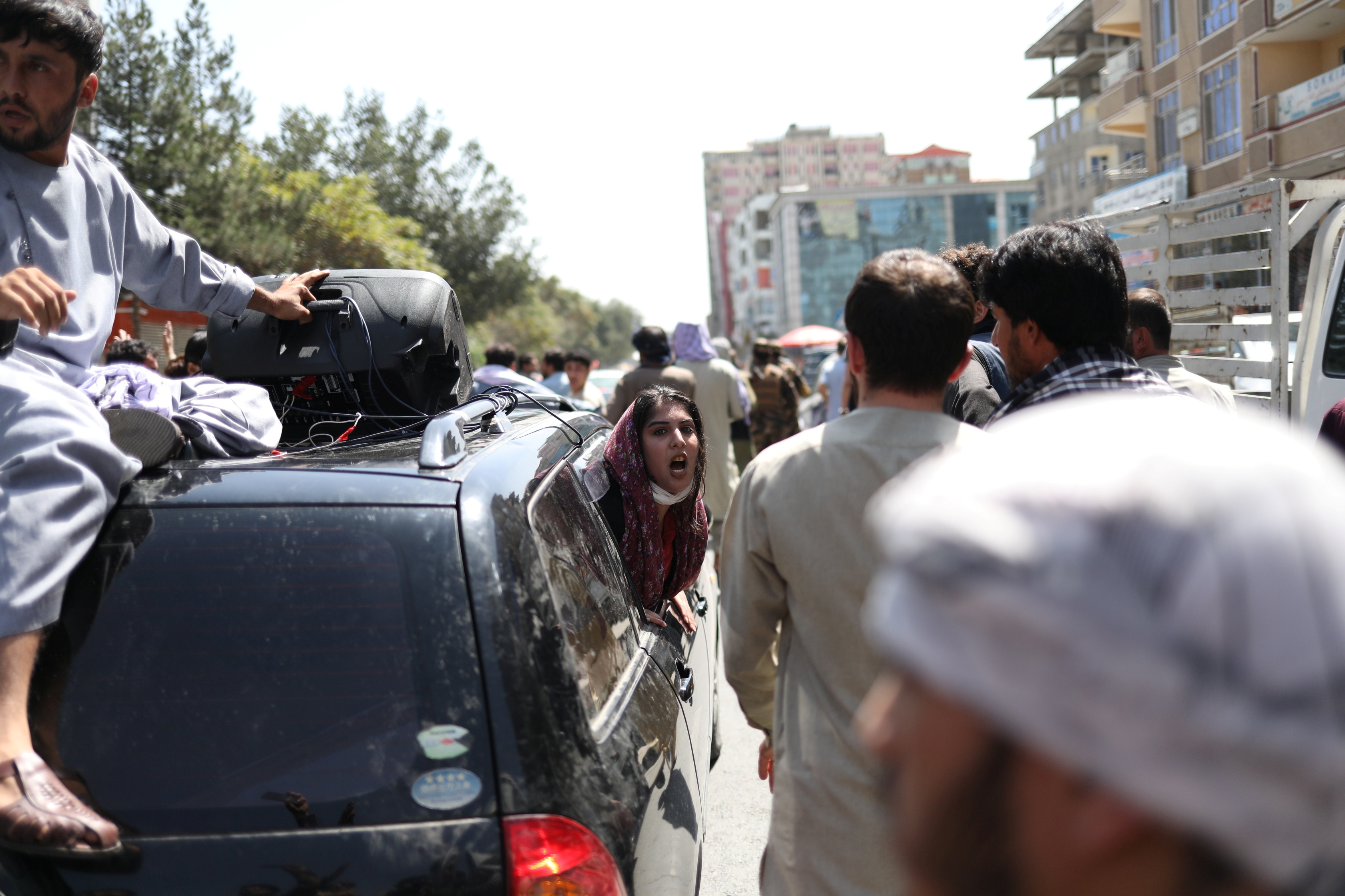 A woman chants from inside of a car during the anti-Pakistan protest in Kabul, Afghanistan, September 7, 2021. WANA (West Asia News Agency) via REUTERS 
