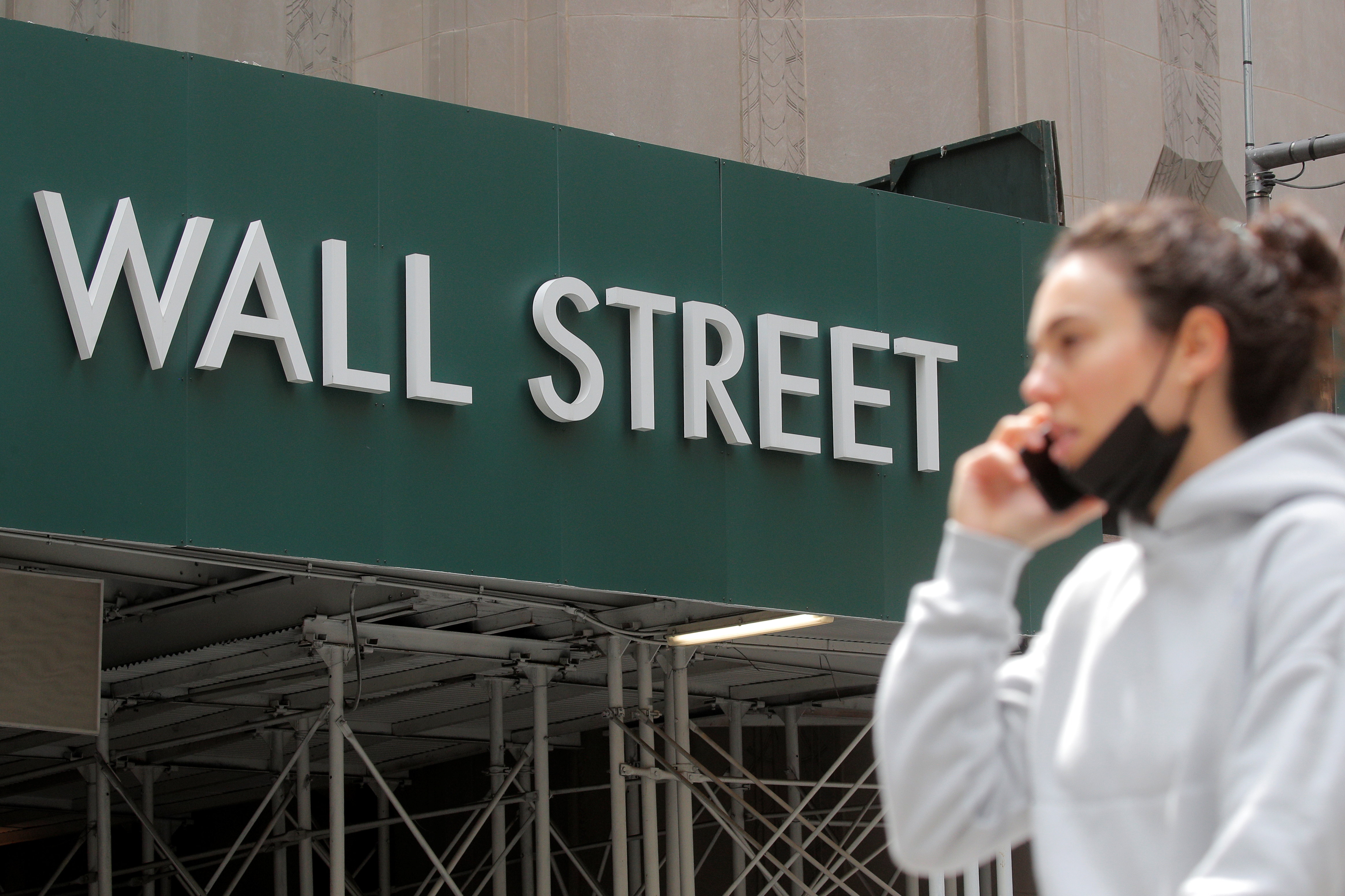 A Wall St. sign is seen near the NYSE in New York