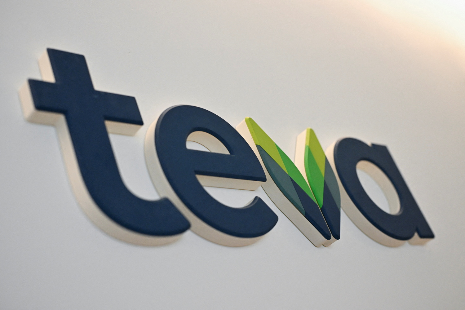 The logo of Teva Pharmaceutical Industries is displayed at the company headquarters in Tel Aviv
