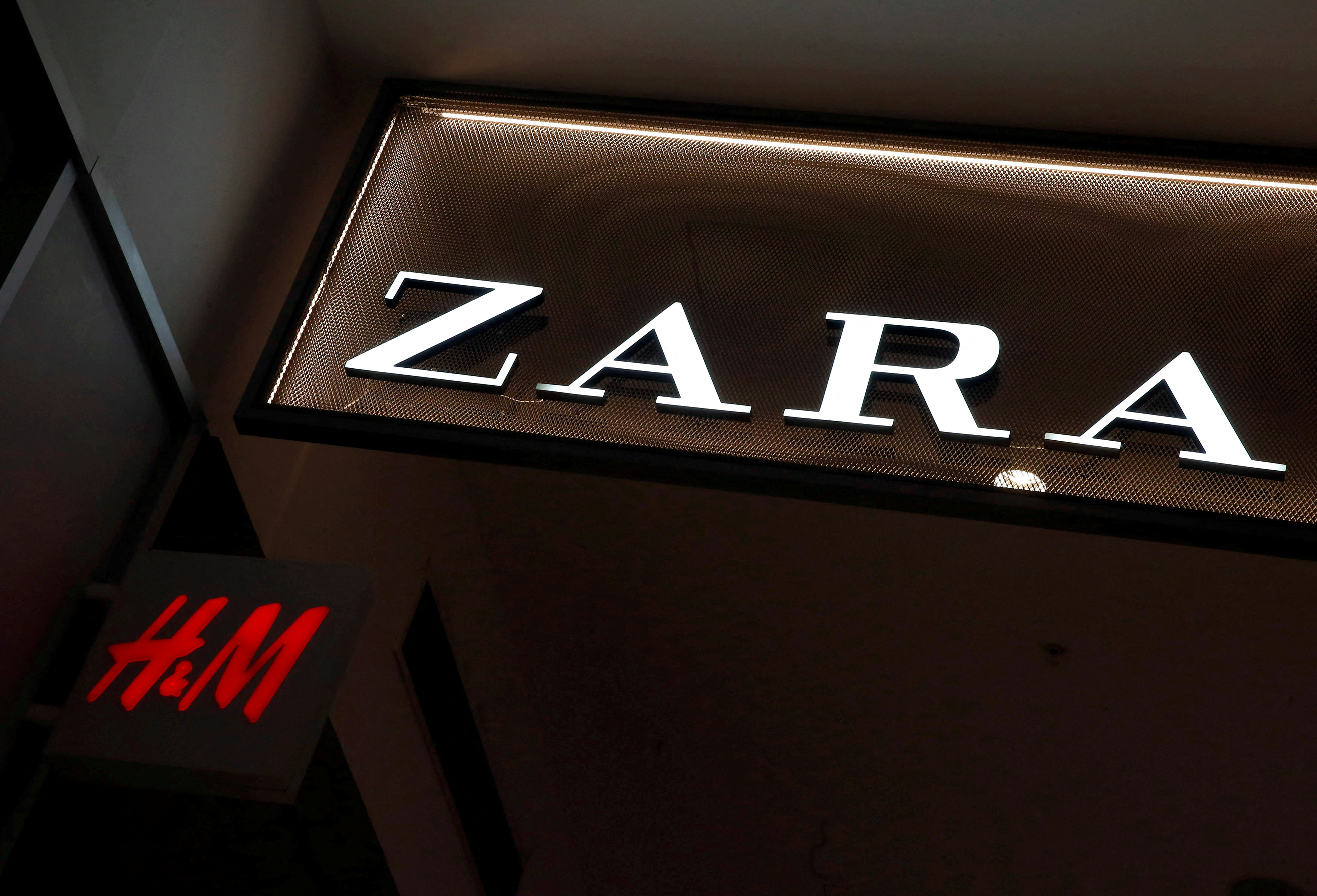 The logos of Zara and H and M stores is seen in a mall at Vina del Mar