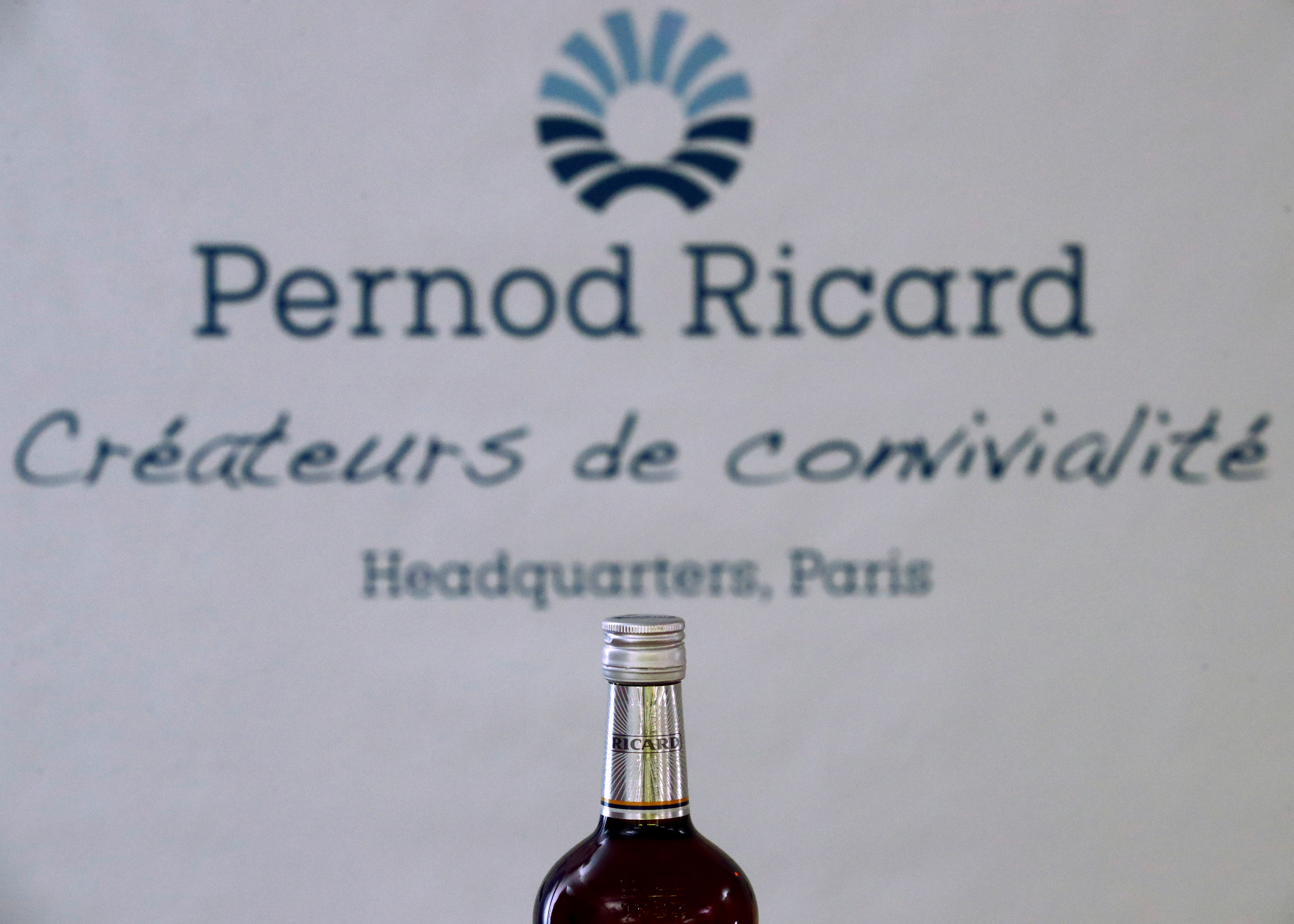 A logo is seen on a bottle of the Ricard aniseed-flavoured beverage displayed during French drinks maker Pernod Ricard news conference to announce the company annual results in Paris