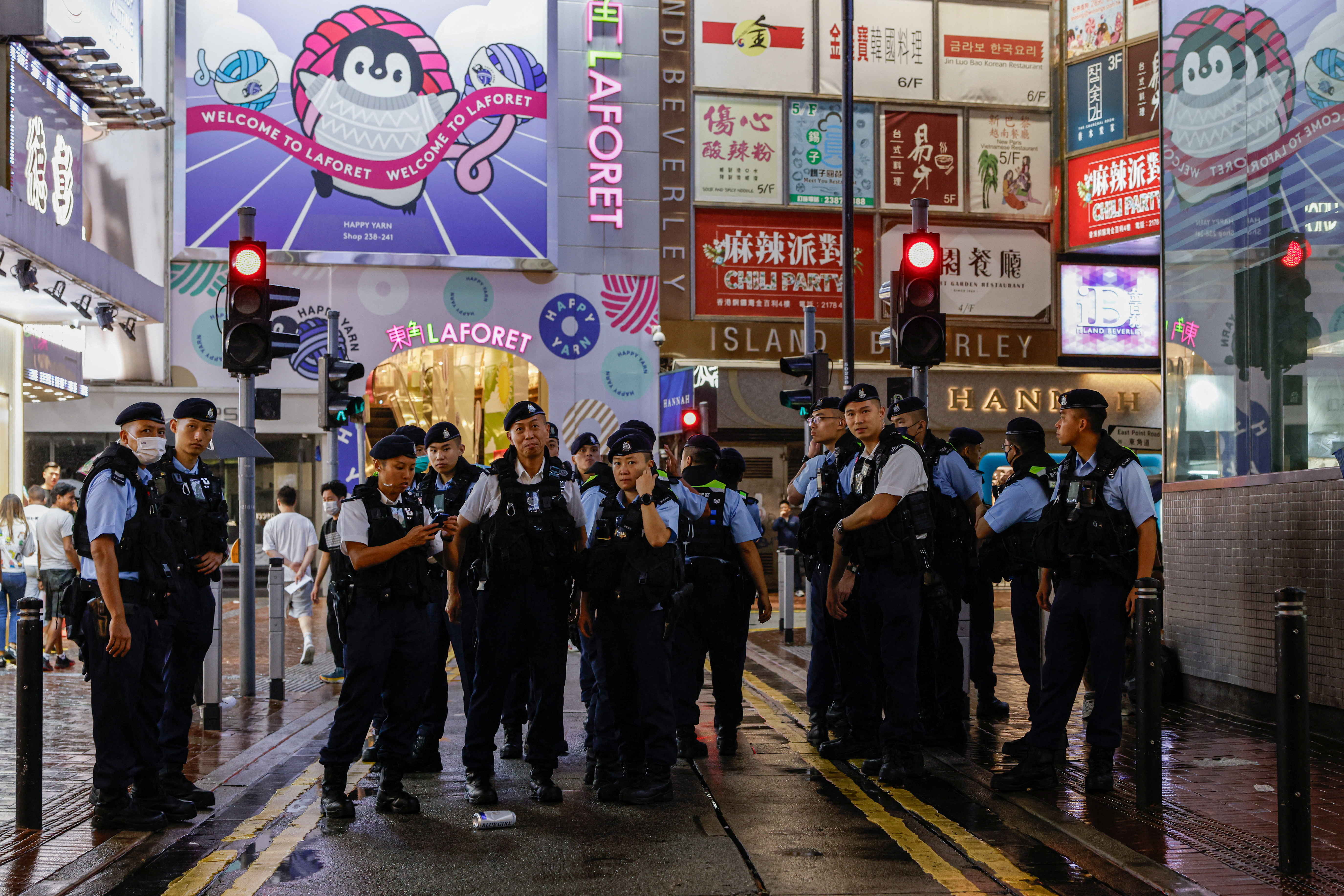 Police stand guard at Causeway Bay, in Hong Kong