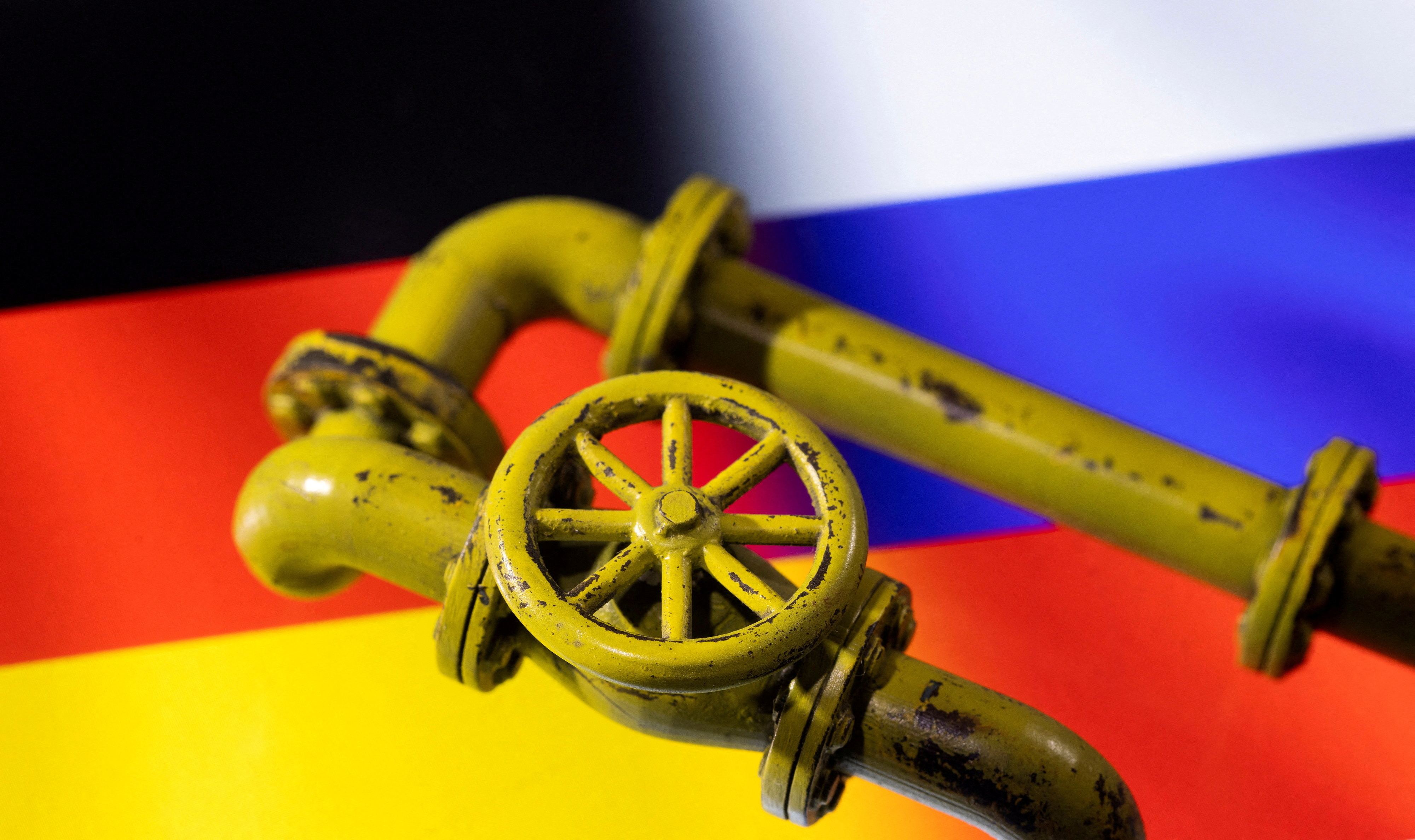 Illustration shows Natural Gas Pipes and German and Russian flags