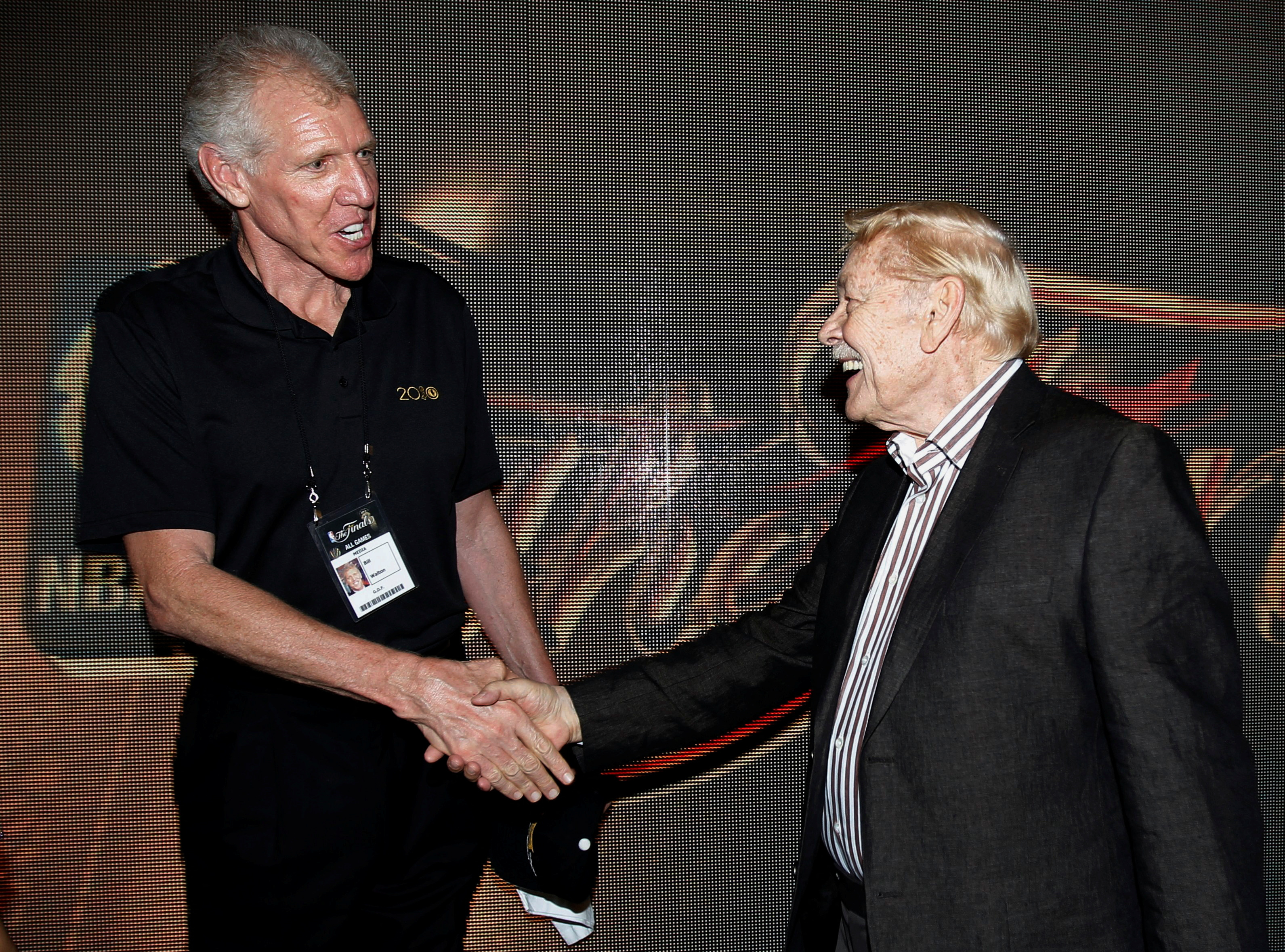 Fomer NBA star Bill Walton talks with Lakers team owner Jerry Buss after Game 7 of the 2010 NBA Finals basketball series in Los Angeles
