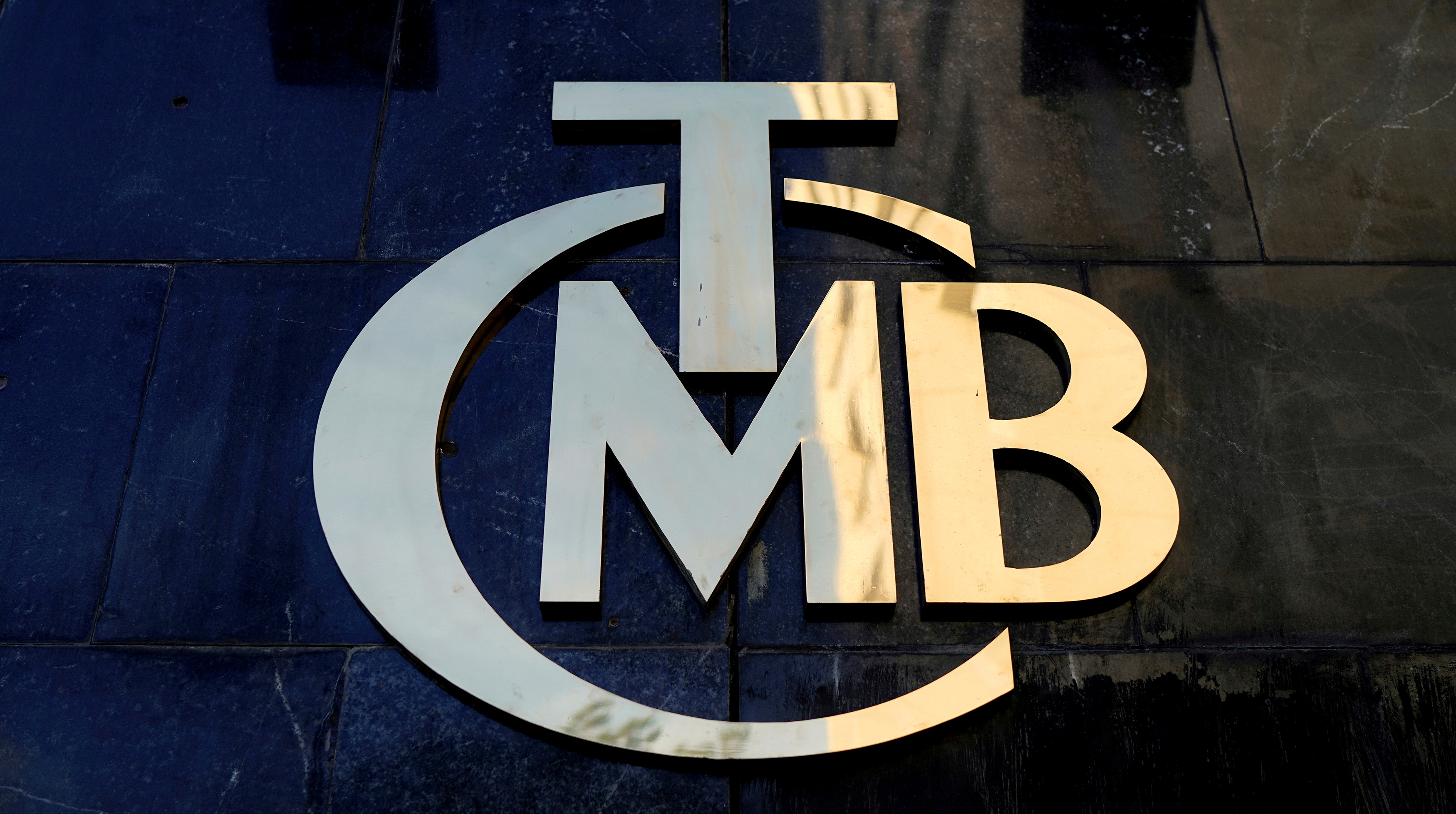 A logo of Turkey's Central Bank is pictured at the entrance of the bank's headquarters in Ankara