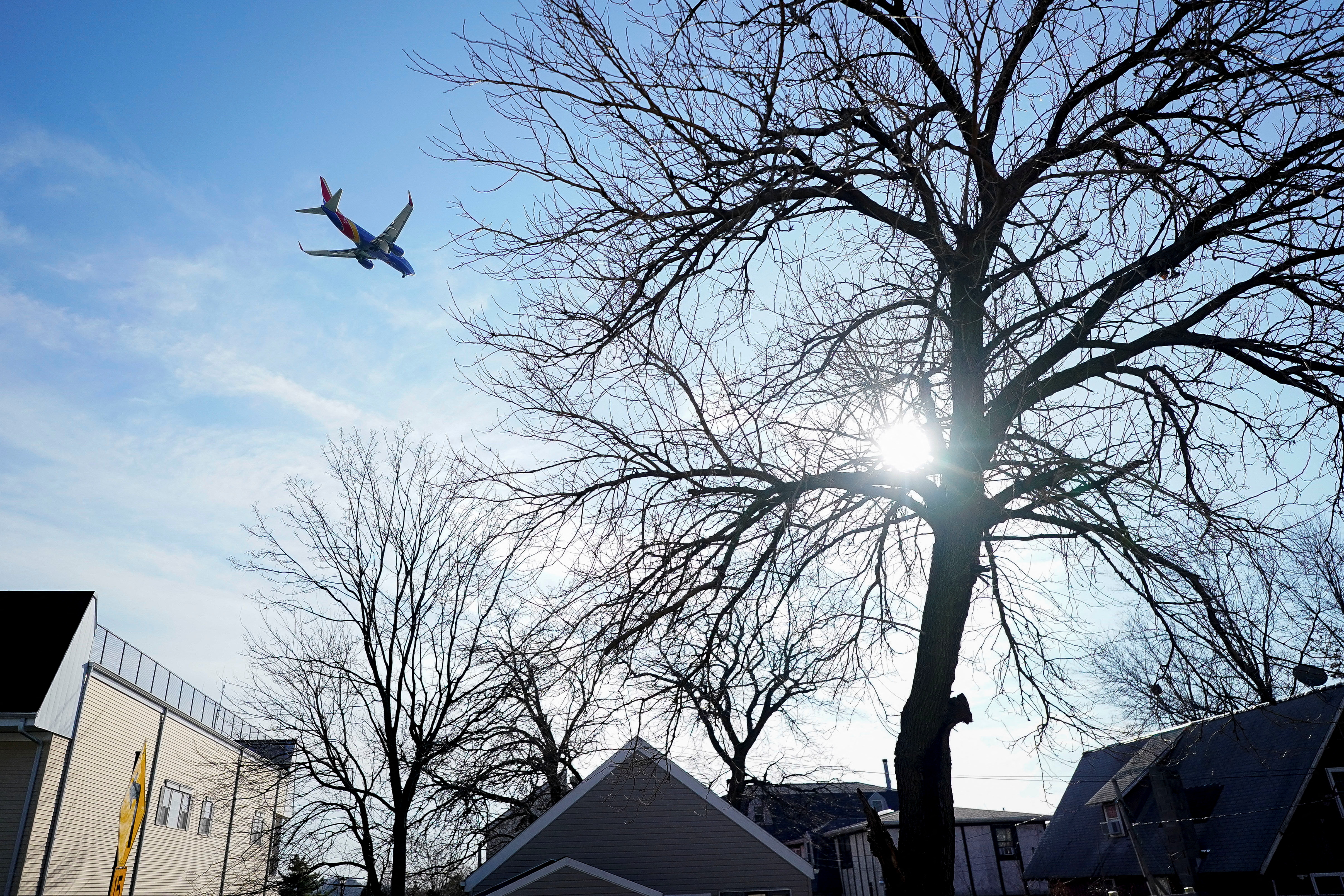 FILE PHOTO -A Southwest Airlines flight flies 500 feet above the ground while on final approach to land at LaGuardia Airport in New York City