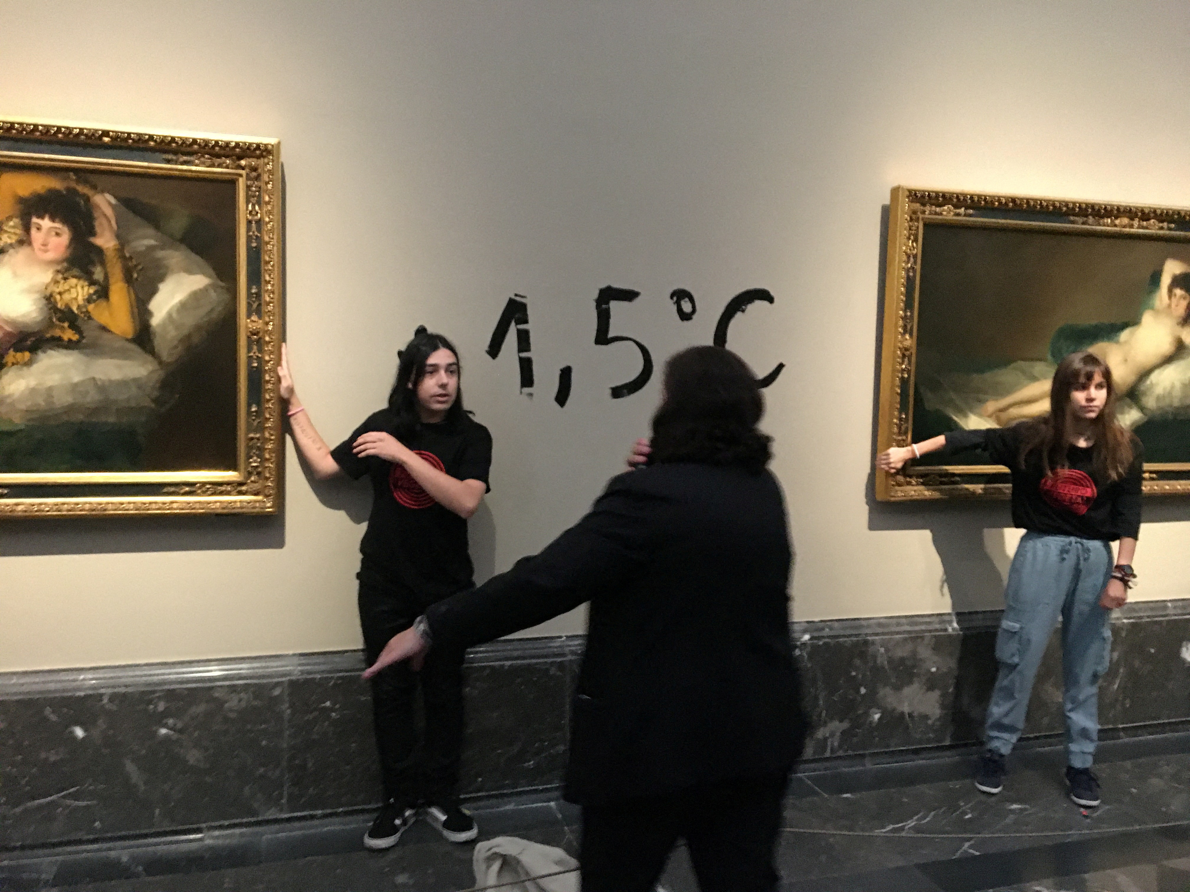 glue themselves Goya paintings Spanish climate protest | Reuters