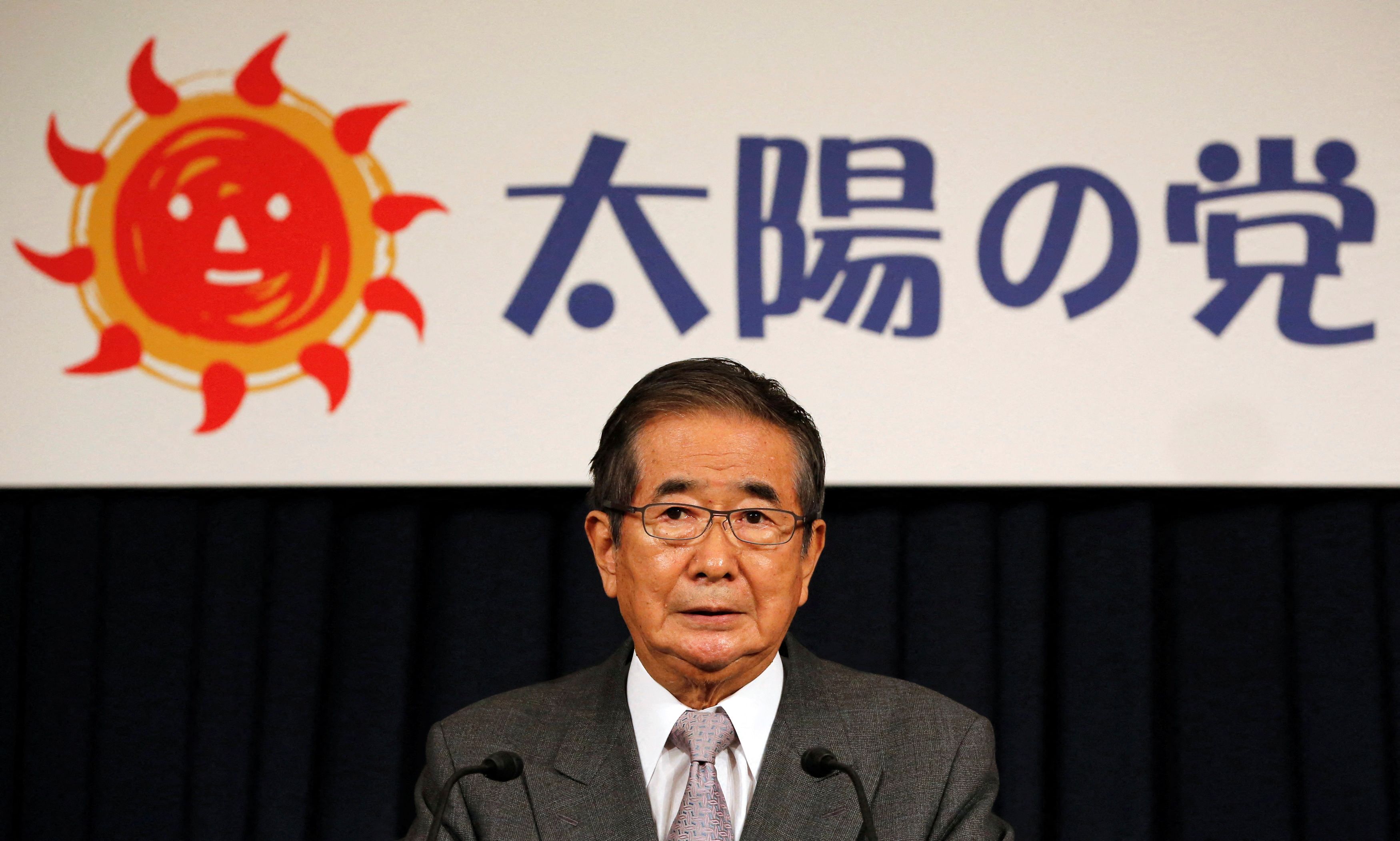 Former Tokyo Governor Ishihara speaks in front of the sign of his new party during a news conference in Tokyo