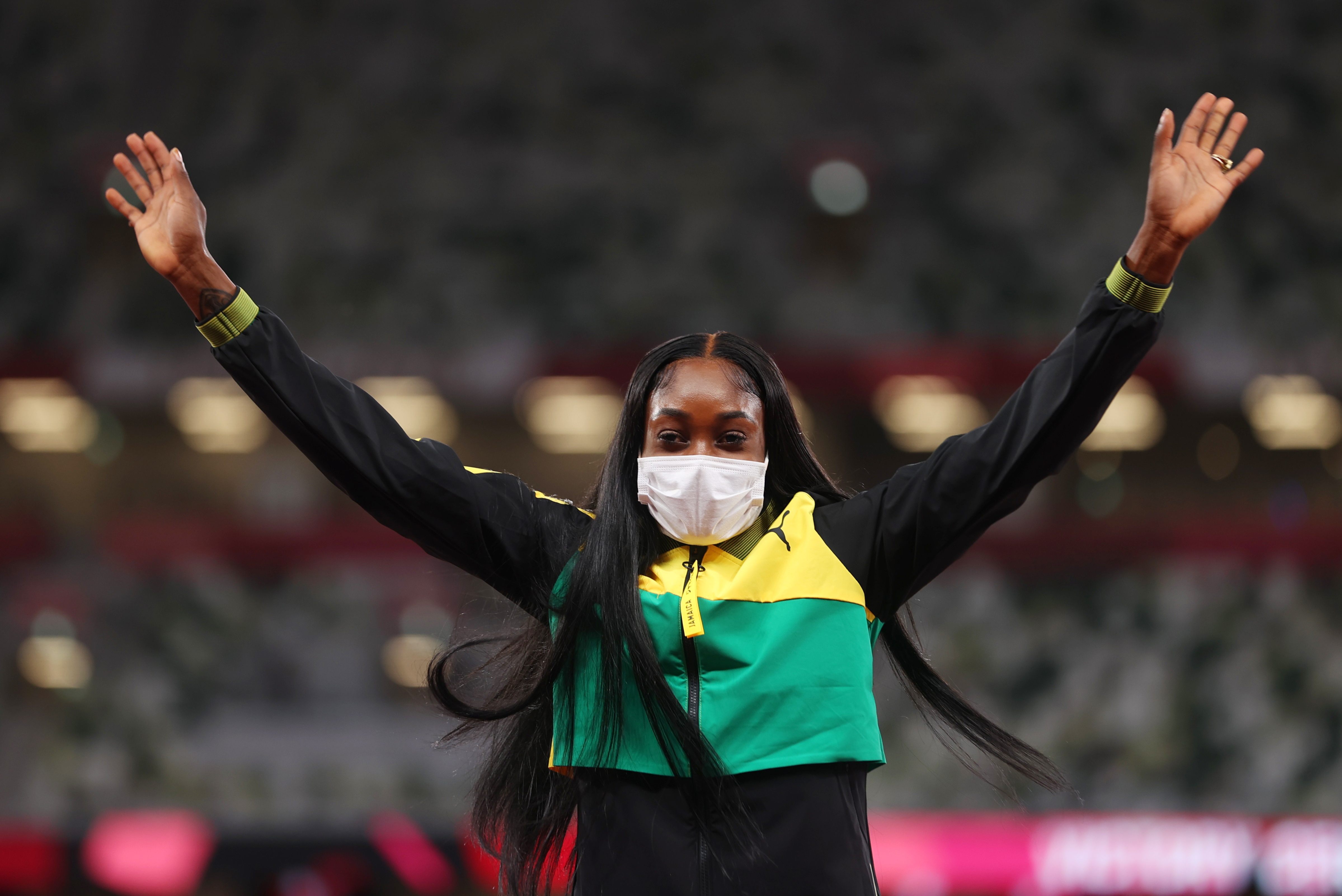 Tokyo 2020 Olympics - Athletics - Women's 200m - Medal Ceremony - Olympic Stadium, Tokyo, Japan - August 4, 2021. Gold medallist Elaine Thompson-Herah of Jamaica celebrates on the podium REUTERS/Lindsey Wasson