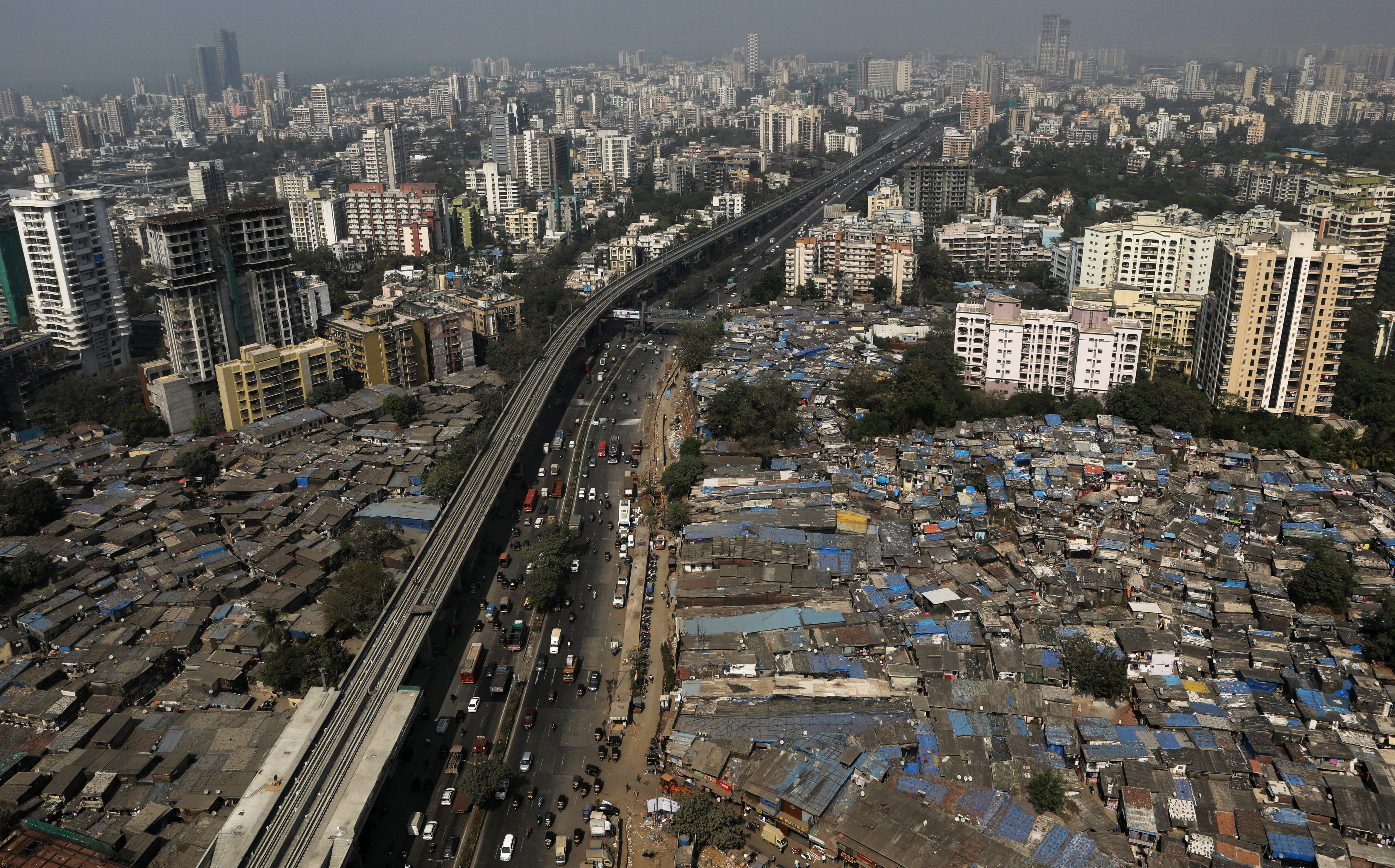 Slums and high-rise buildings are seen in Mumbai