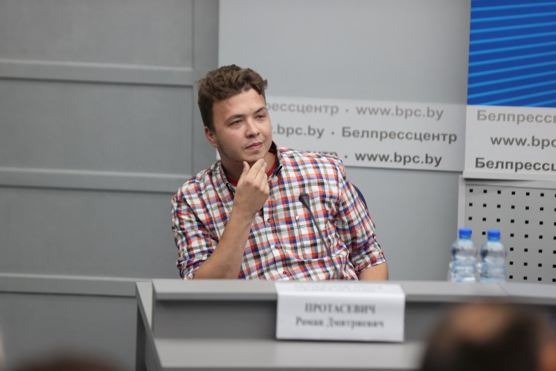 Jailed Belarus journalist Roman Protasevich takes part in a press conference in Minsk