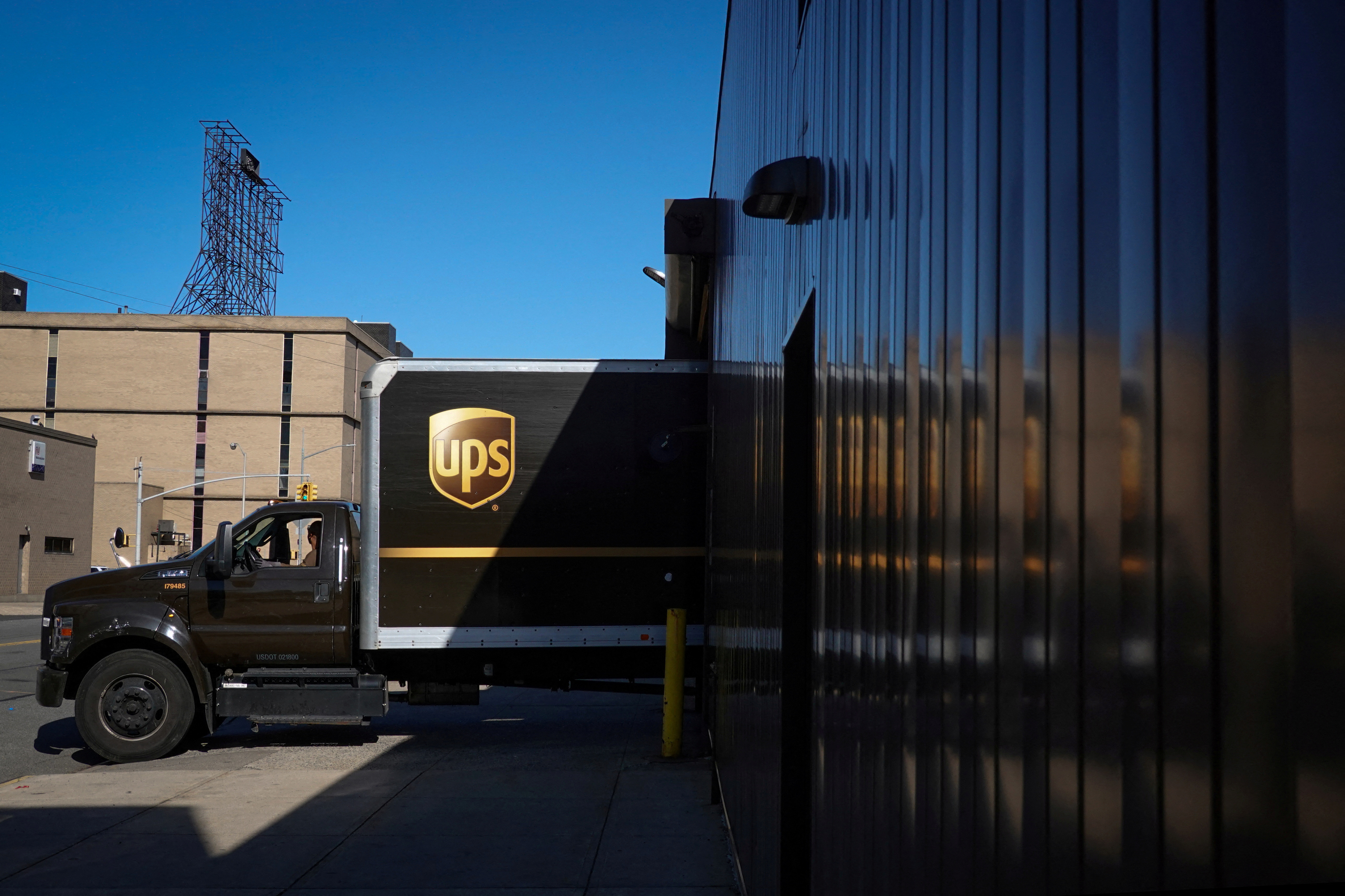 A United Parcel Service (UPS) vehicle reverses into a facility in Queens, New York City