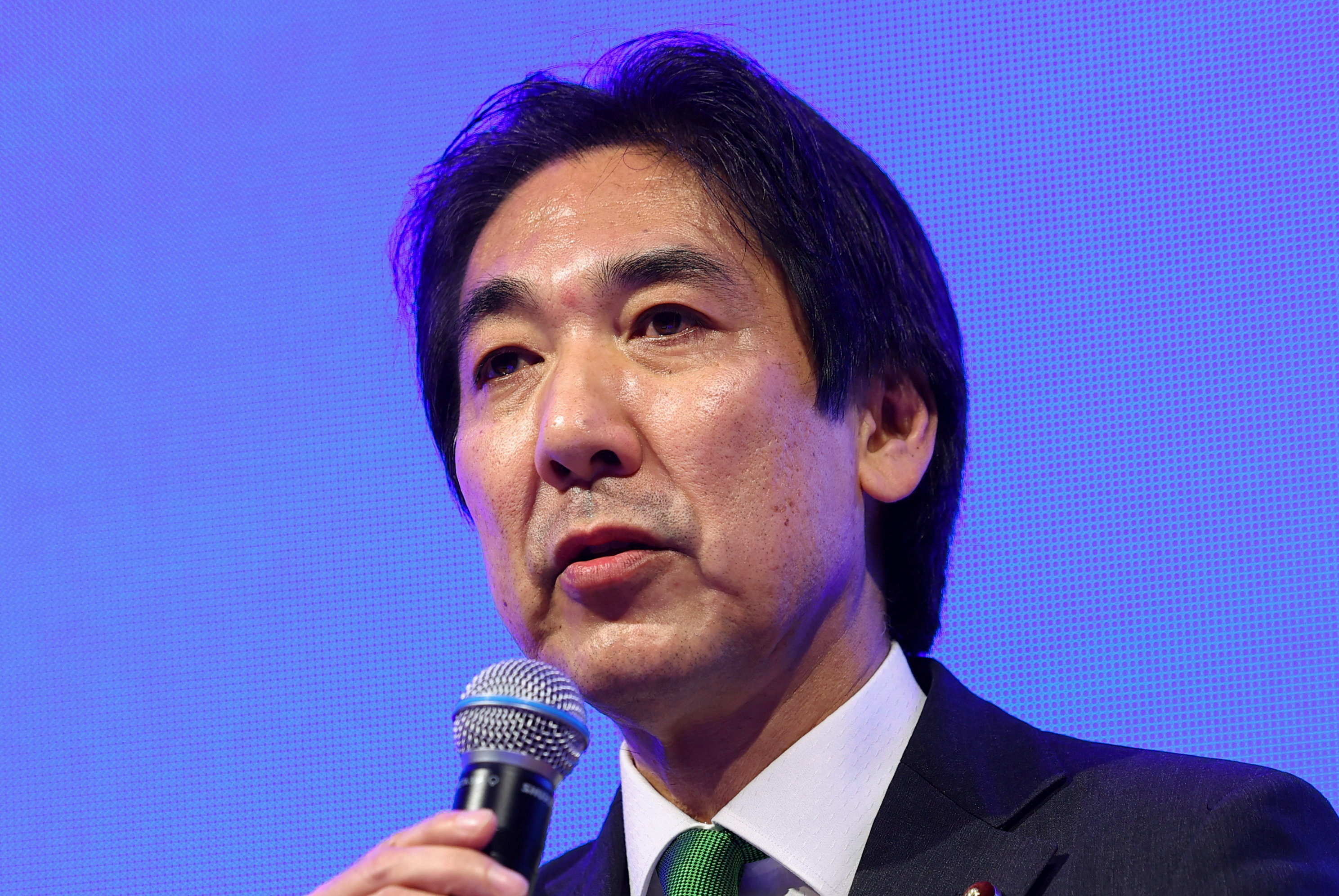 Japan is not yet officially out of deflation, economy minister says