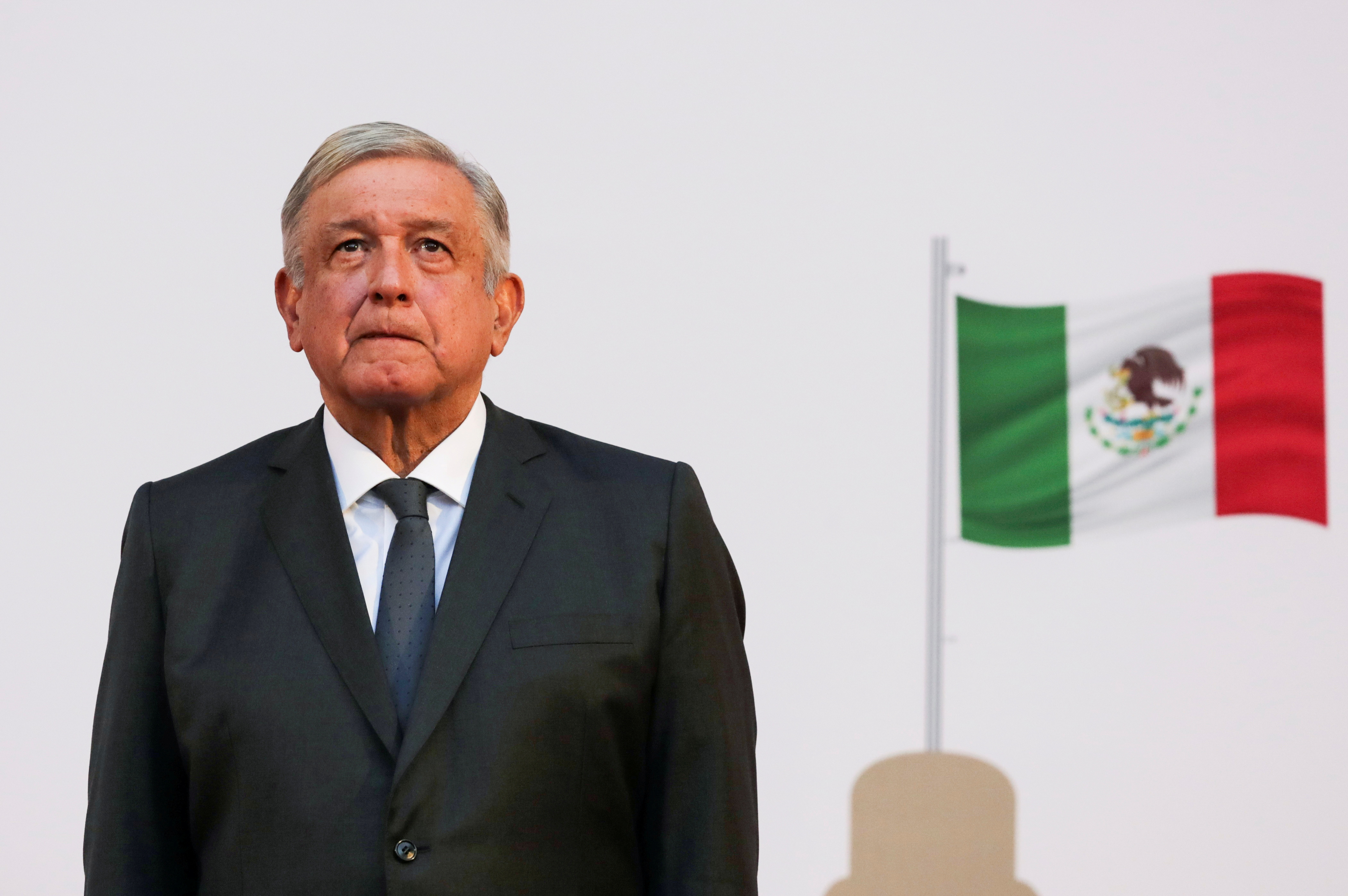 Mexico President Andres Manuel Lopez Obrador listens to the national anthem after addressing the nation