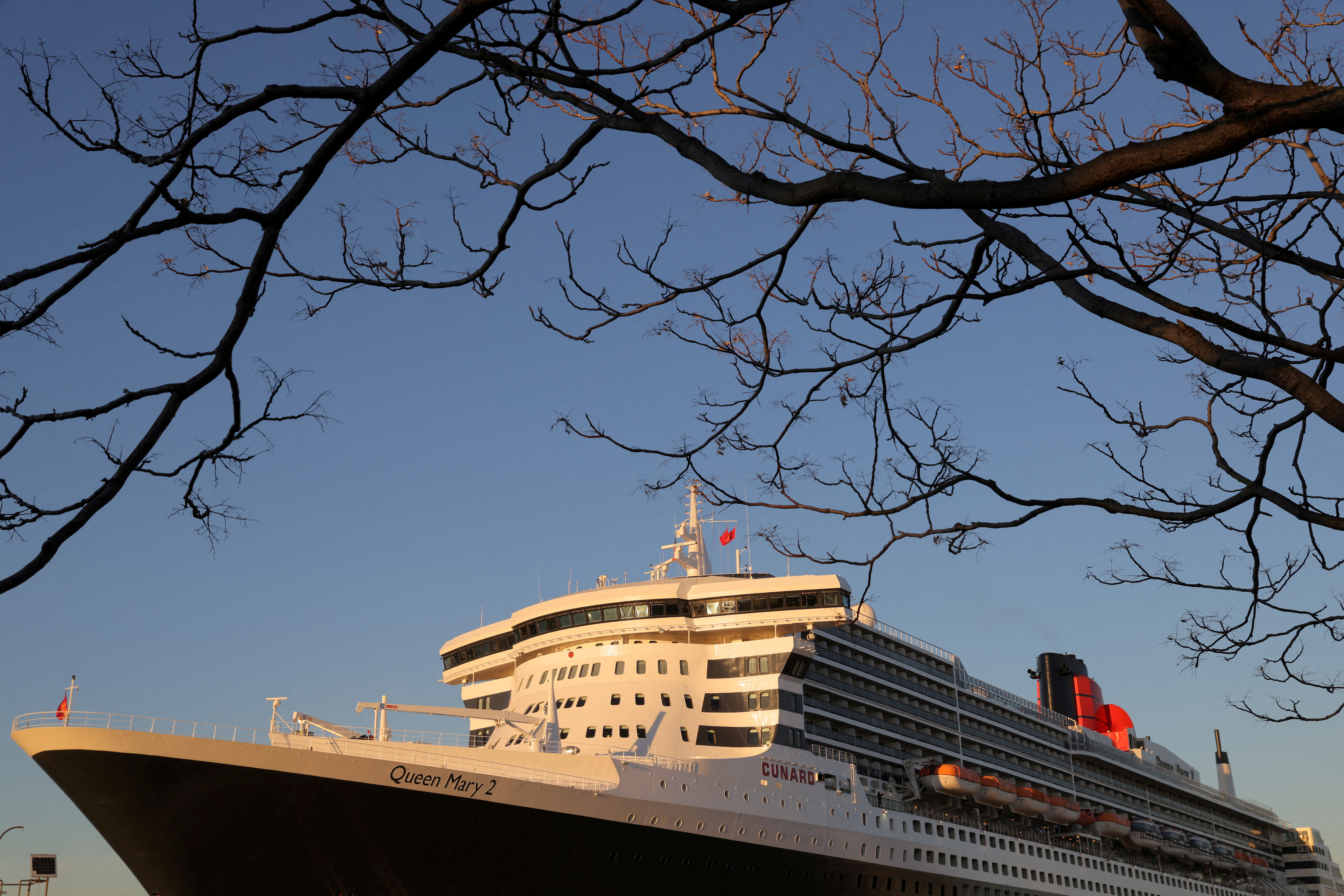 The Queen Mary 2 cruise ship by Cunard Line, owned by Carnival Corporation & plc. is seen docked at Brooklyn Cruise Terminal in Brooklyn, New York City