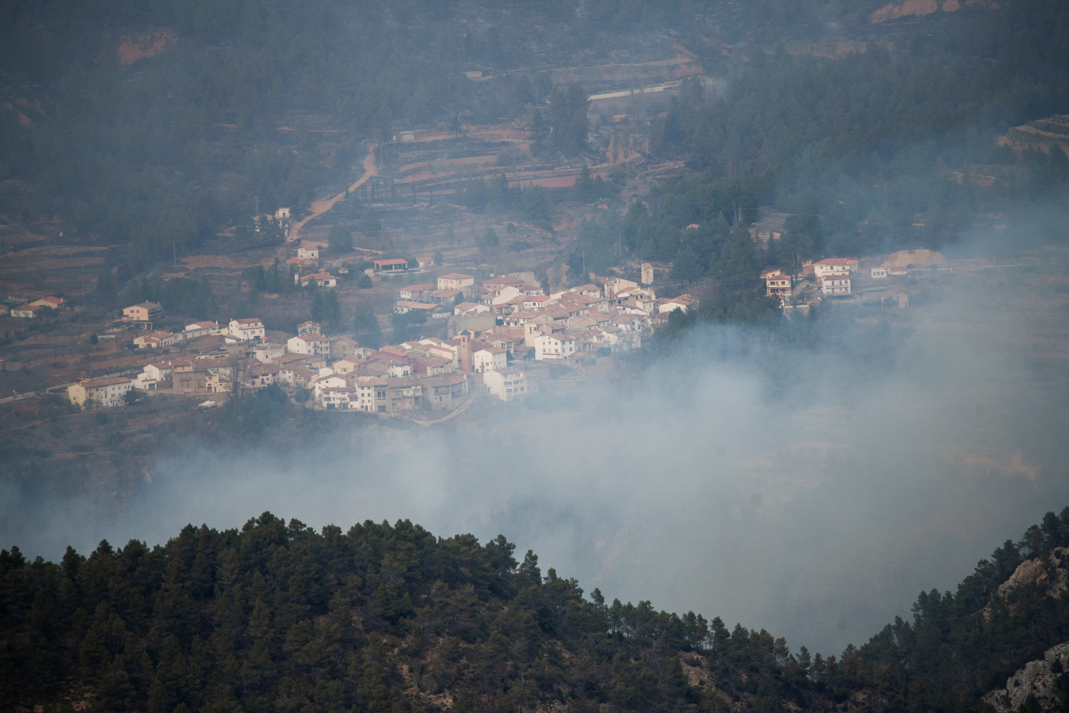 Smoke rises during a wildfire in Los Calpes