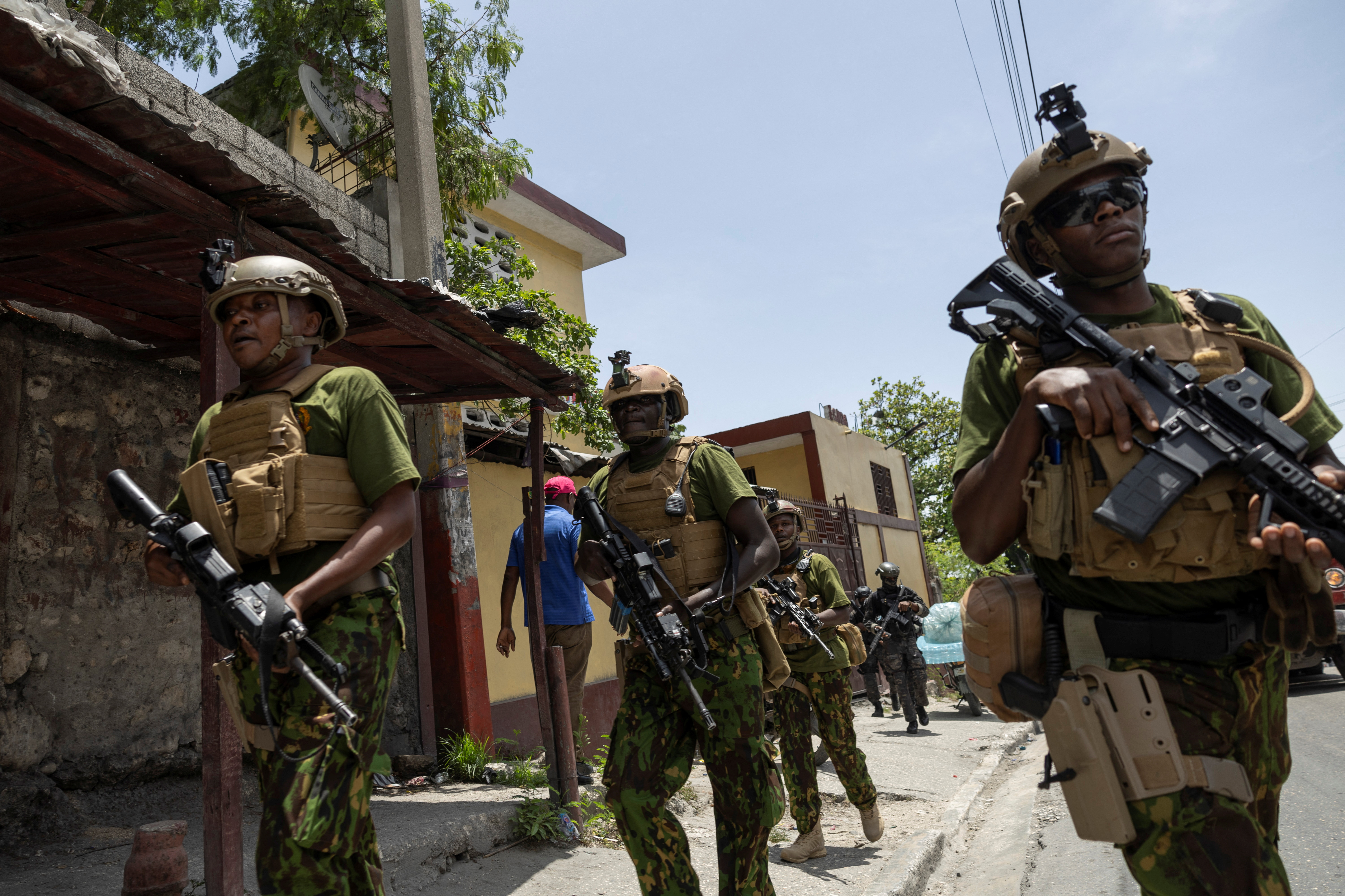 Kenyan police and Haitian National police SWAT units patrol streets in armoured vehicles, in Port-au-Prince