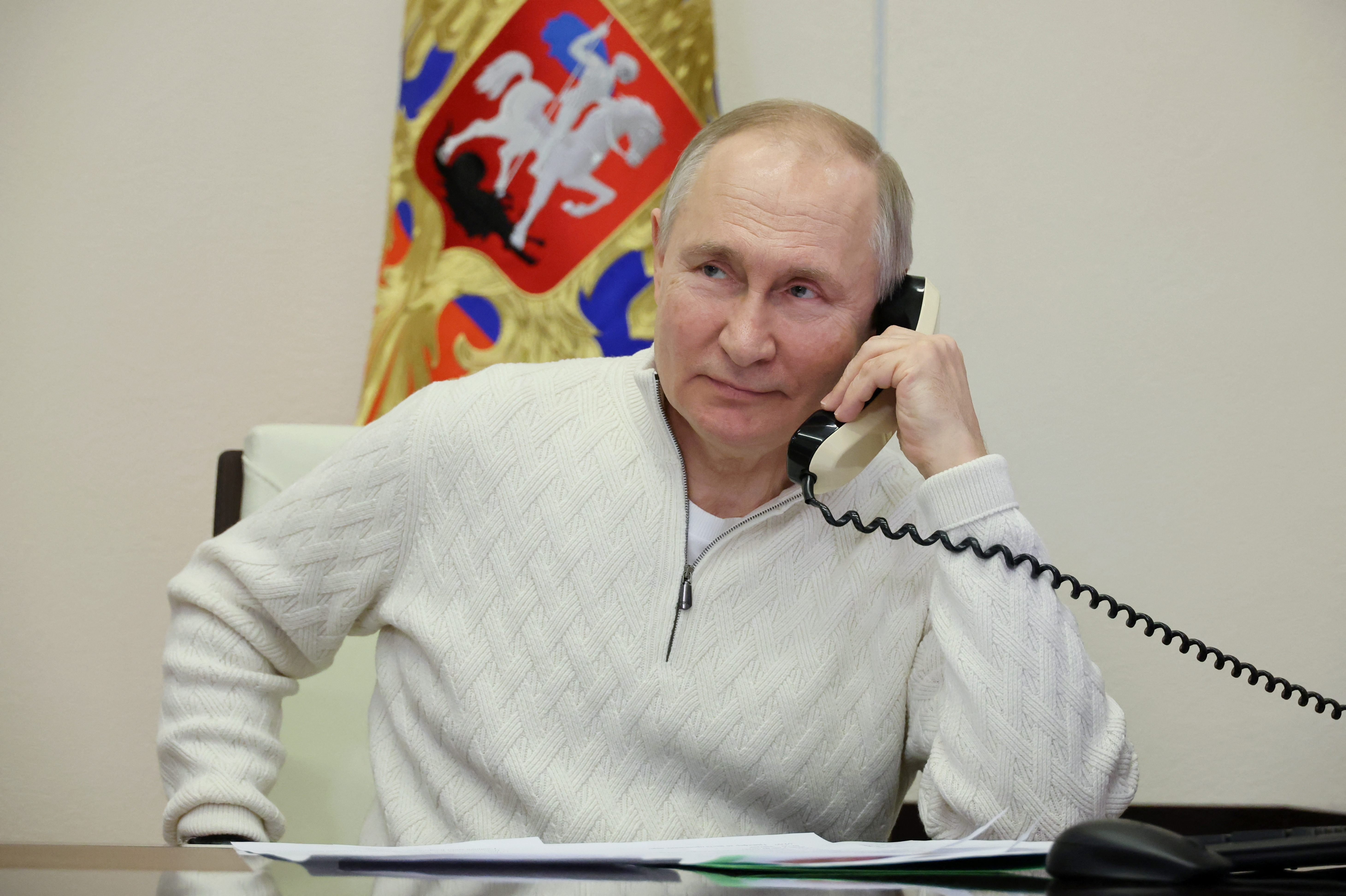 Russia's President Vladimir Putin speaks on the phone with a participant of a charity event, in Moscow region