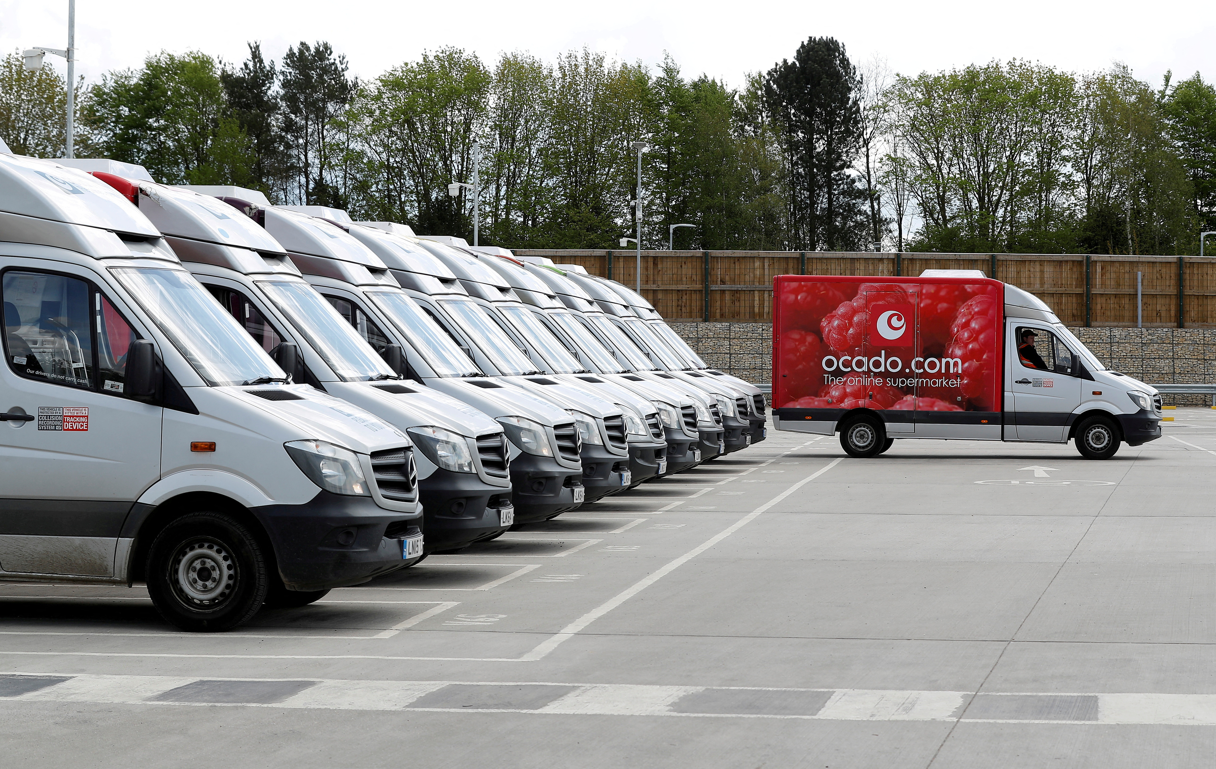 Ocado delivery vans lined up prior to dispatch
