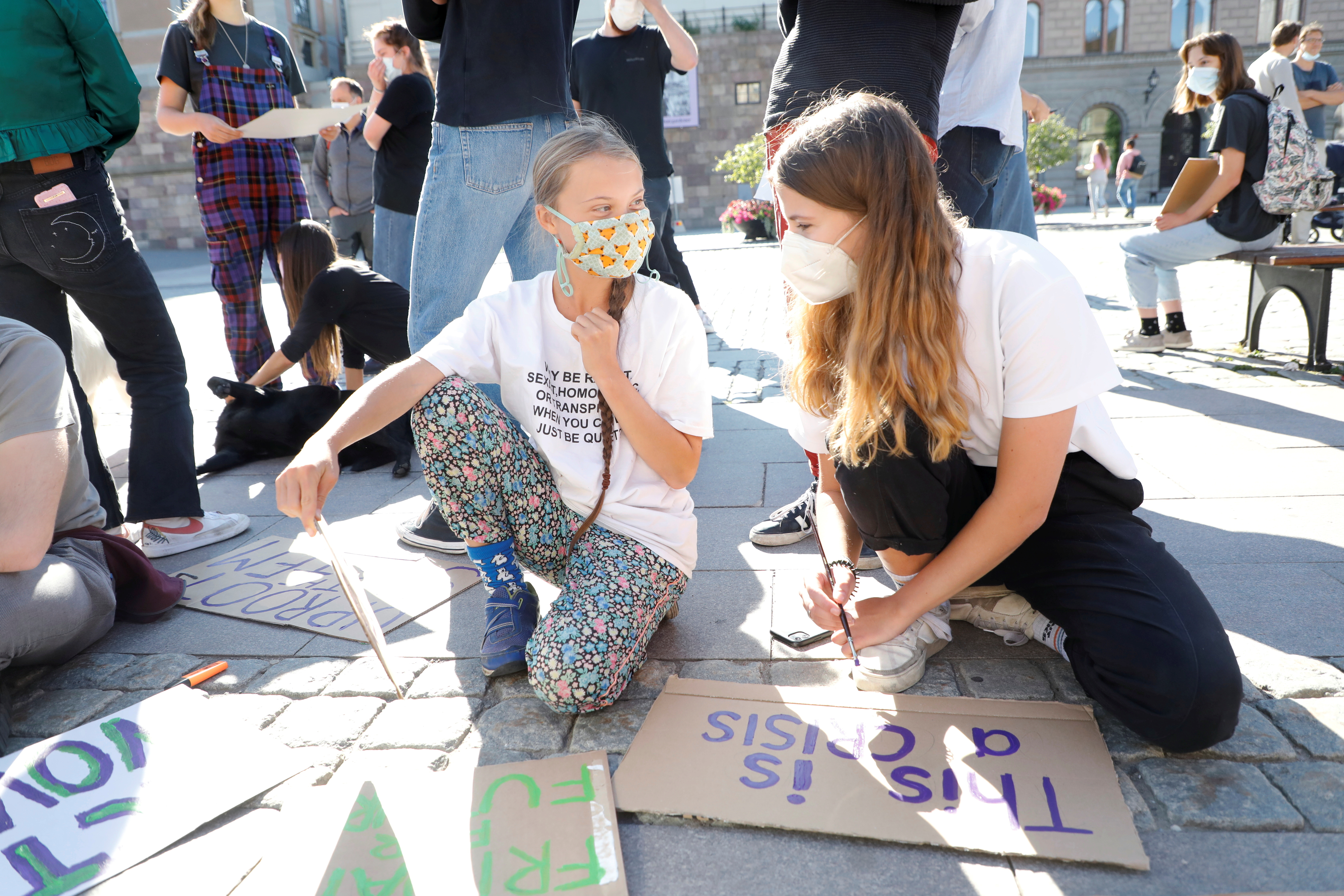Greta Thunberg and Luisa Neubauer protest outside the Swedish Parliament