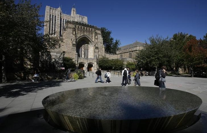 Students walk on the campus of Yale University in New Haven, Connecticut