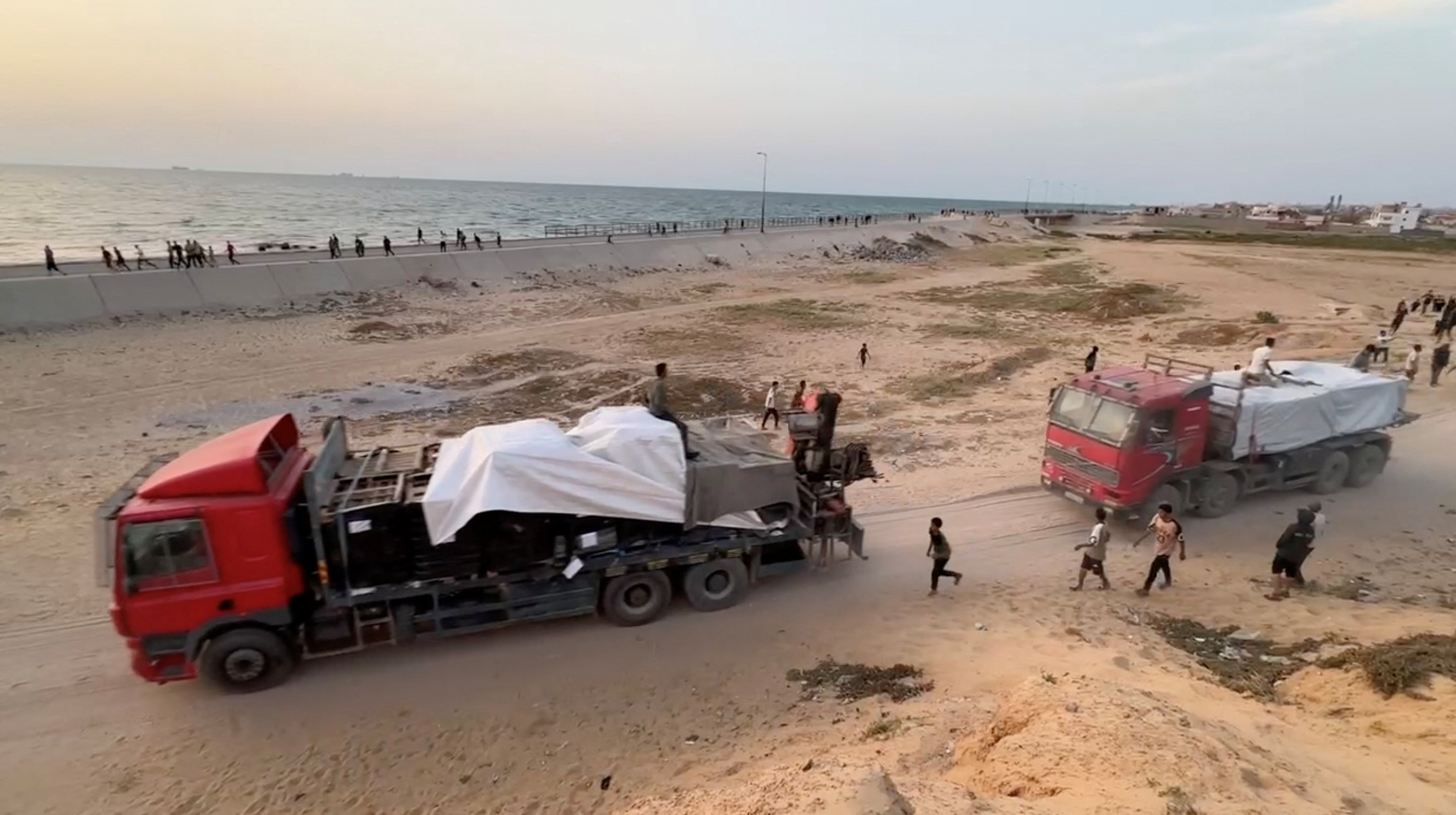 Aid begins to arrive in Gaza via US-built pier | Reuters