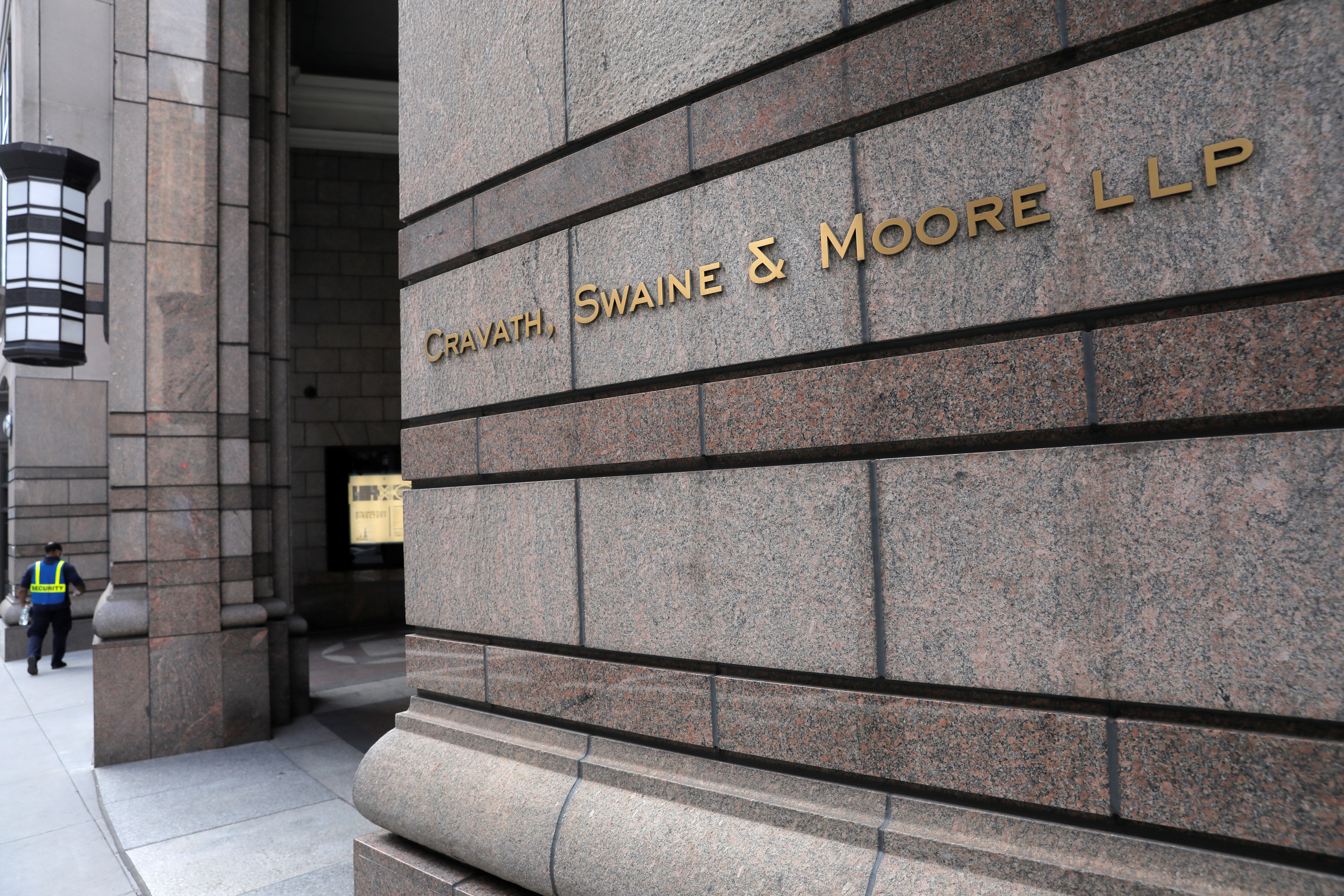 Signage is seen on the exterior of the building where law firm Cravath, Swaine & Moore LLP are located in Manhattan, New York City