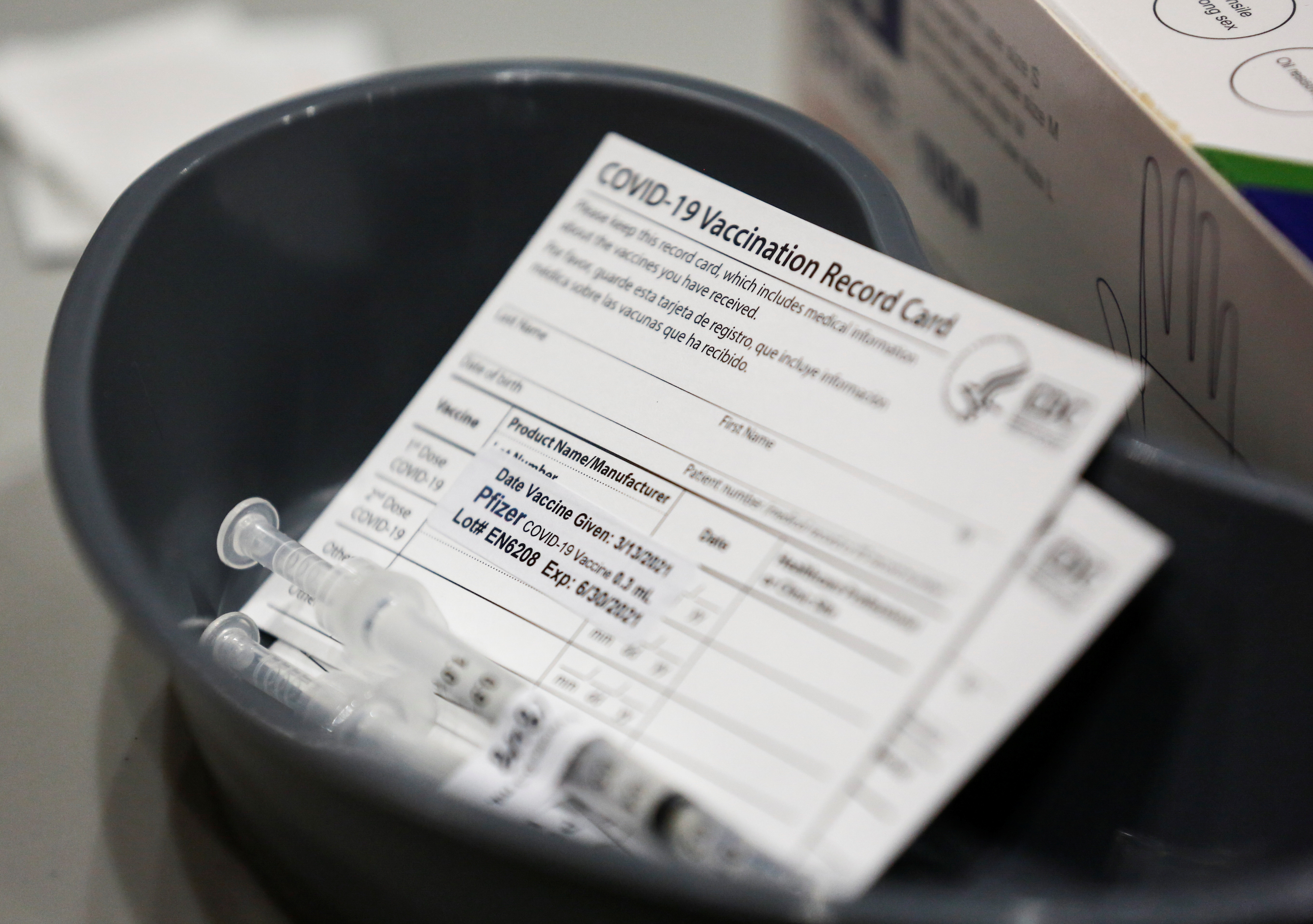 A Pfizer coronavirus disease (COVID-19) vaccine card is seen at a mass vaccination site at Lumen Field Event Center in Seattle