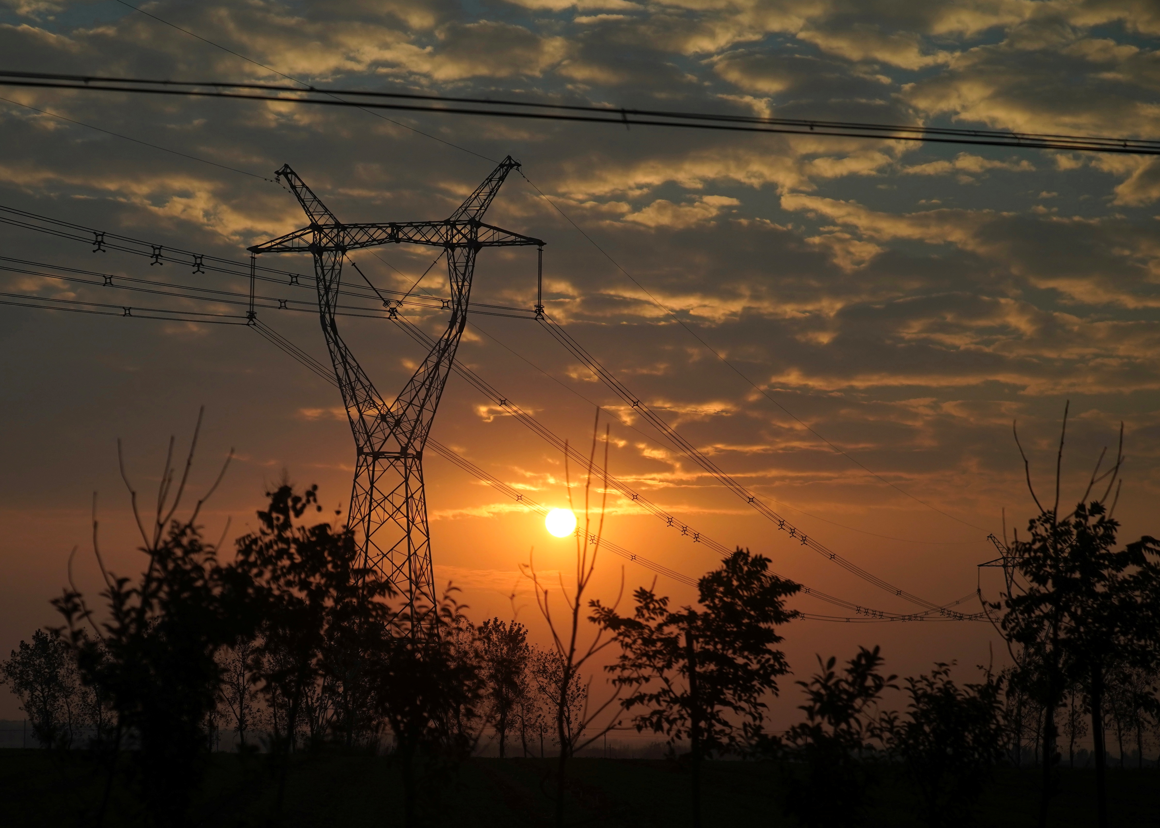 Electricity pylon and power lines are seen in Nanyang, Henan
