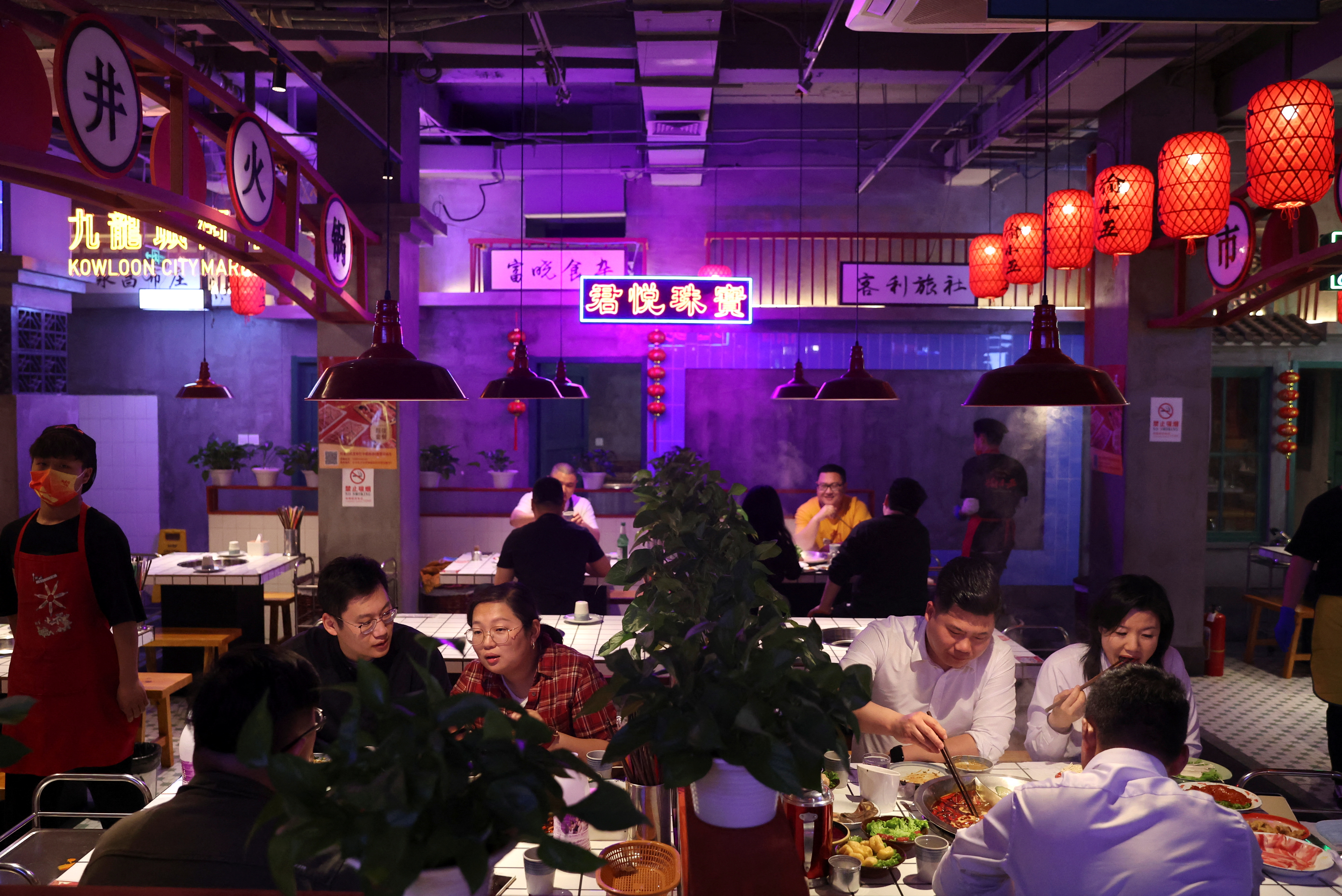 People dine at a hotpot restaurant in Beijing