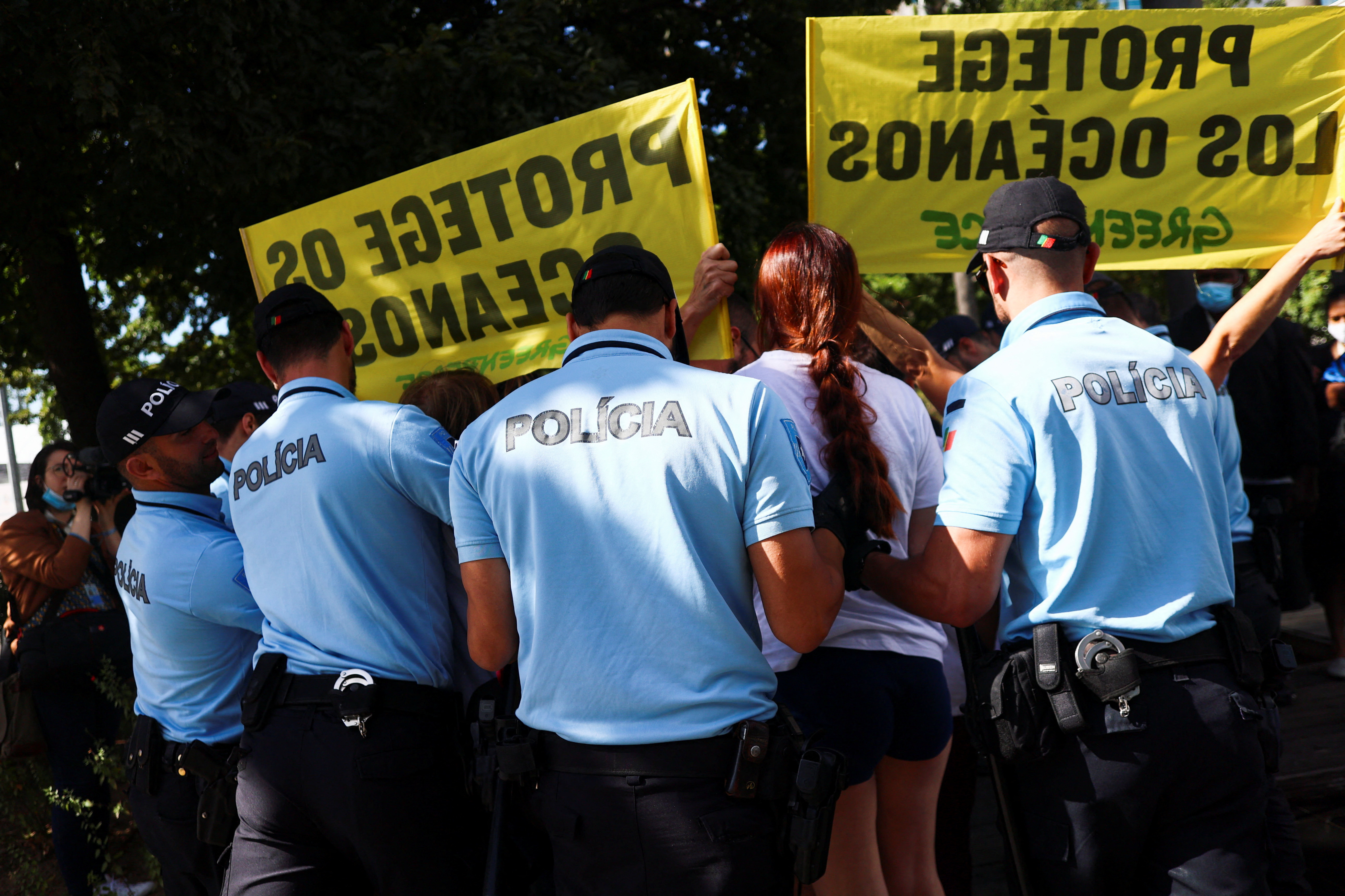 Greenpeace activists demonstrate outside the U.N. Ocean Conference in Lisbon